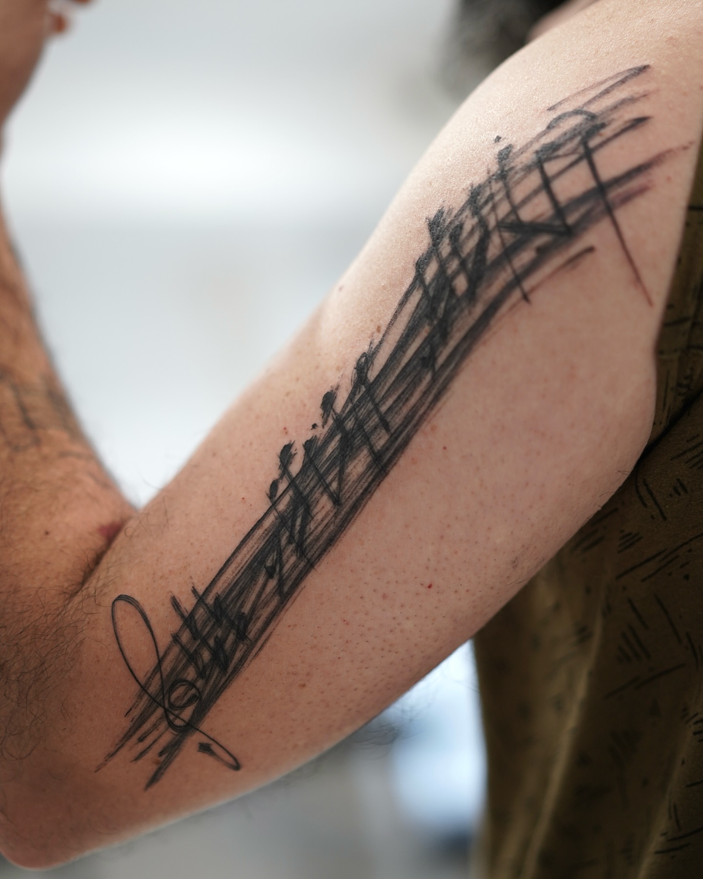 Music notes black and grey tattoo on the forearm by Young one 영원