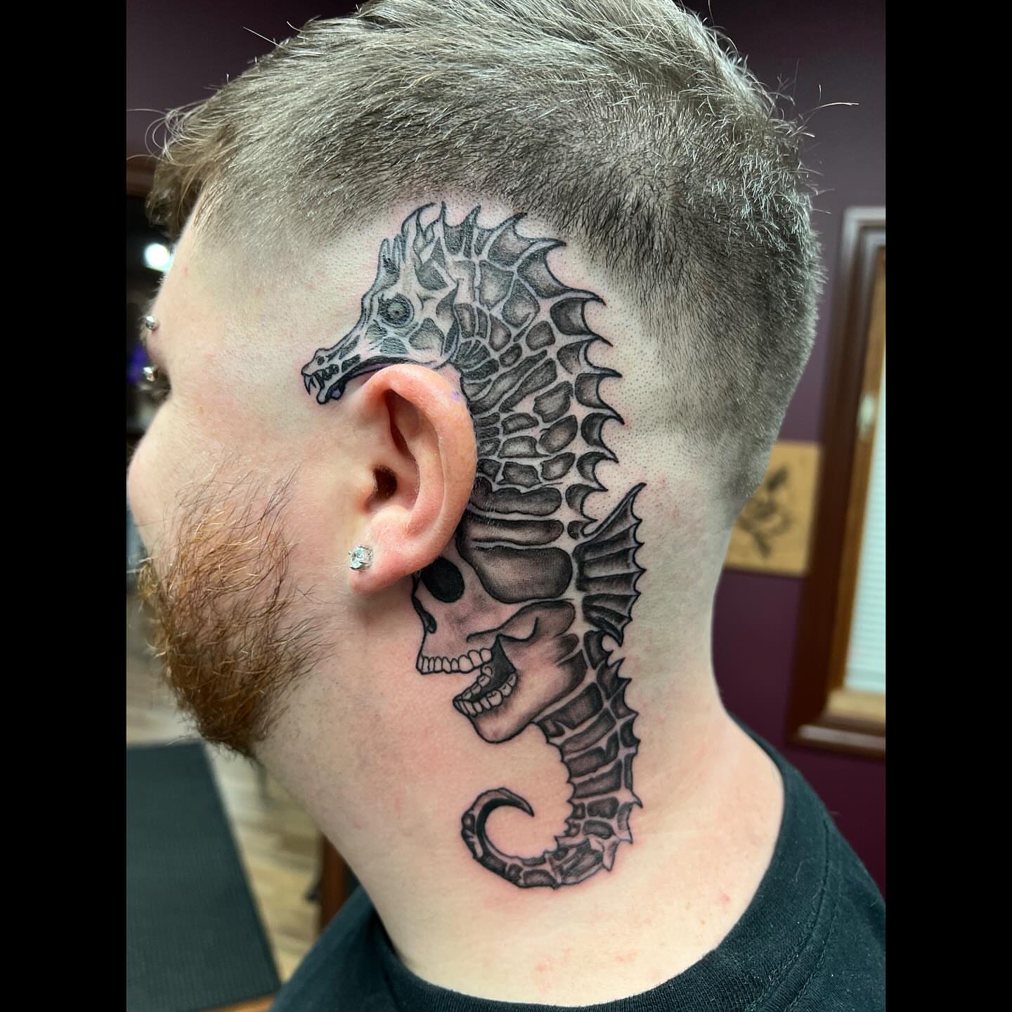 Seahorse black and grey tattoo on the neck by Ali, Cedar Rapids, Iowa