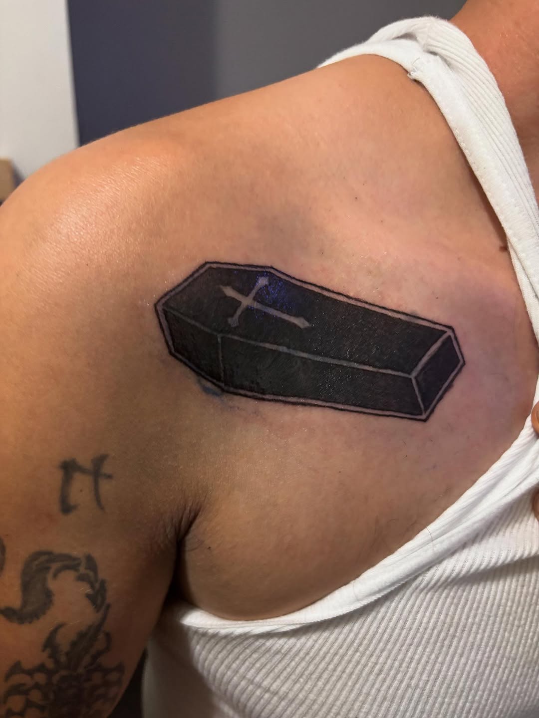 Coffin with cross tattoo on the shoulder by Ink_ Hustle36