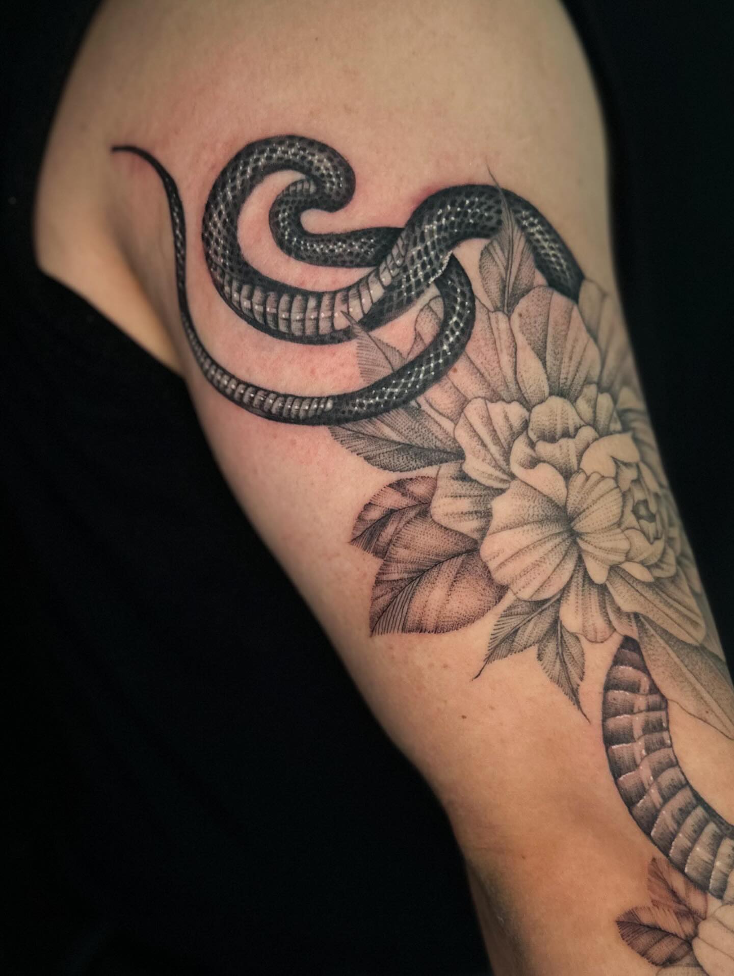 Snake and peony realism tattoo on the forearm by Jhonny David lay