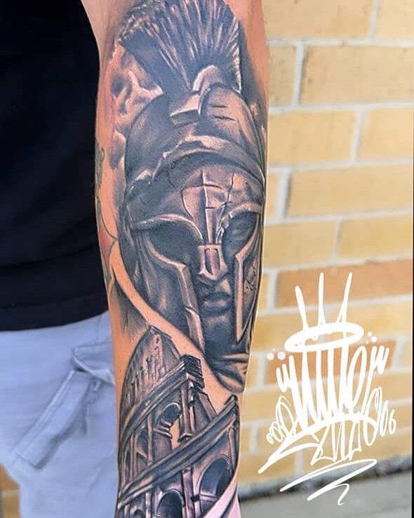 Roman warrior helmet and Colosseum realism tattoo on the forearm by Lu Ve, Dayton, Ohio