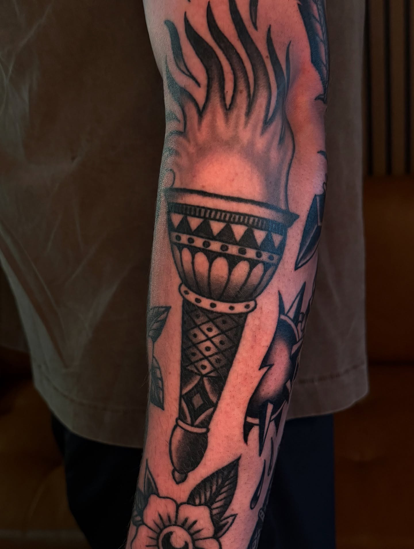 Torch American traditional tattoo on the forearm by Cory Allen