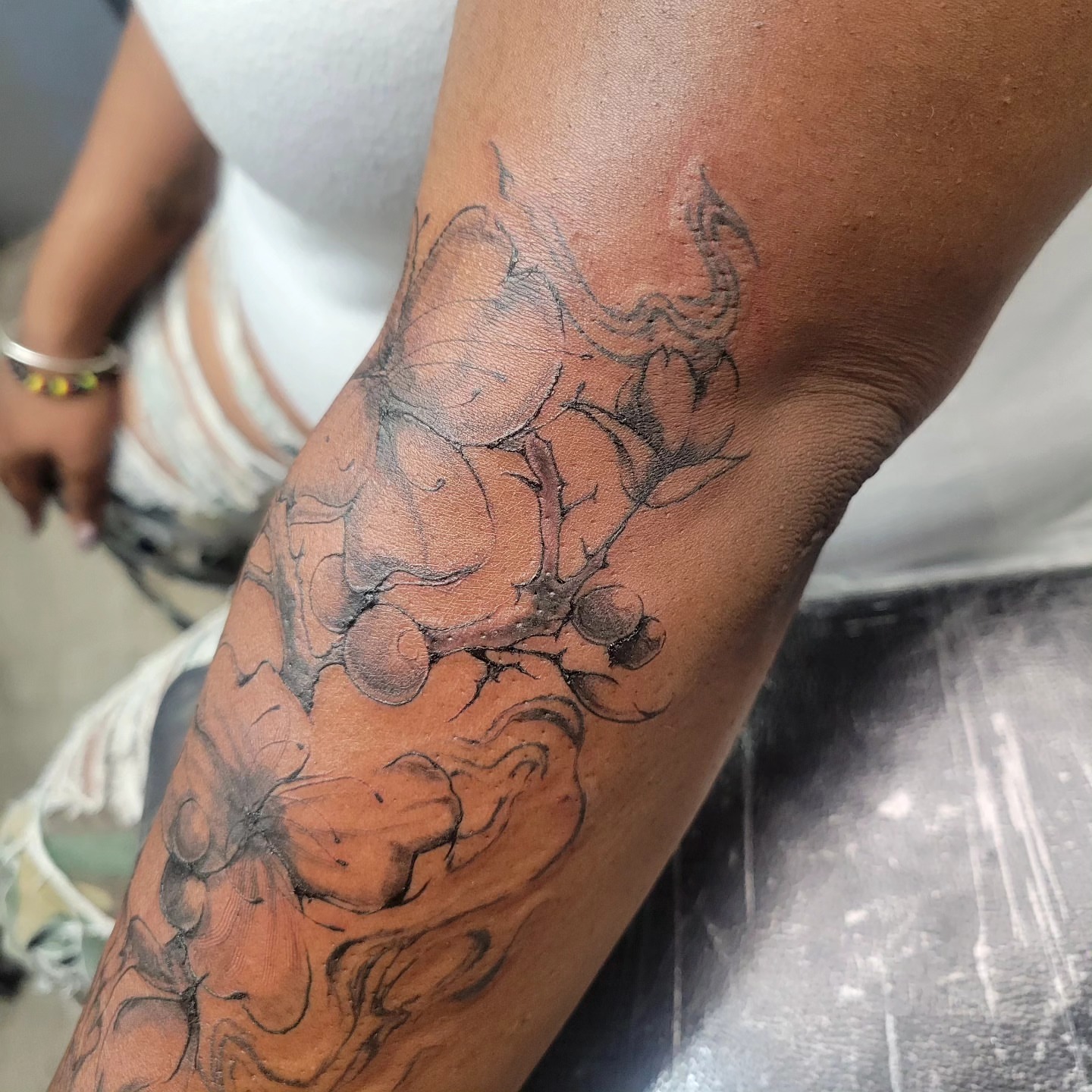 Flower and dragon black and grey tattoo on the forearm by LolaCat🐉