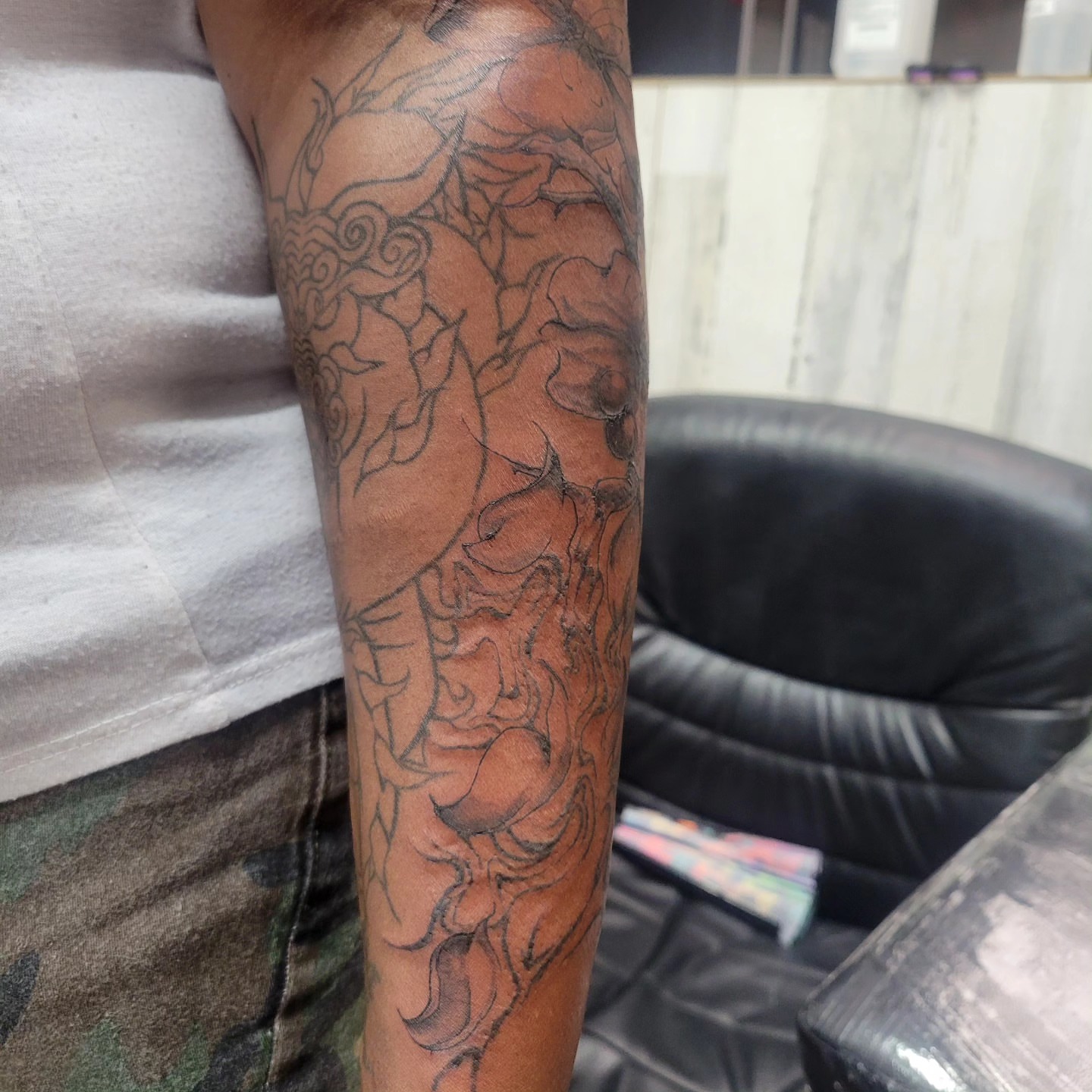 Abstract design black and grey tattoo on the forearm by LolaCat🐉