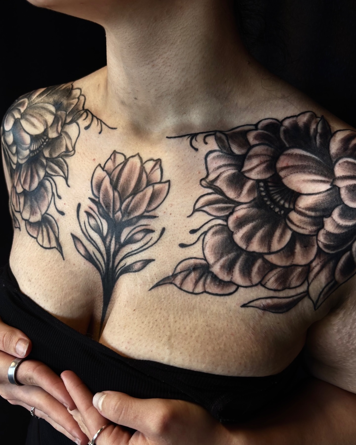 Floral arrangement black and grey tattoo on the chest by Nashville Tattoo Artist
