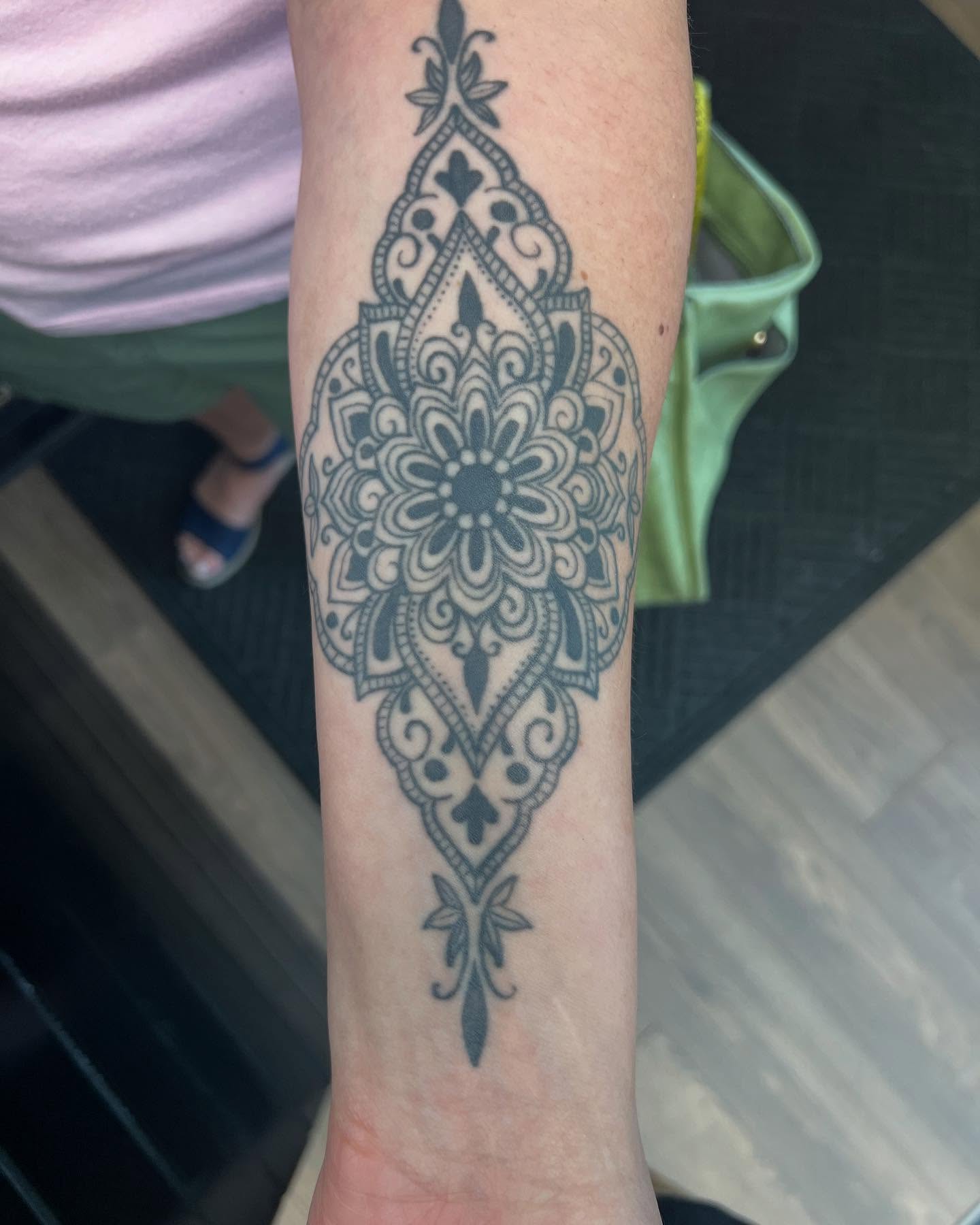 Mandala ornamental tattoo on the forearm by Cody Marl