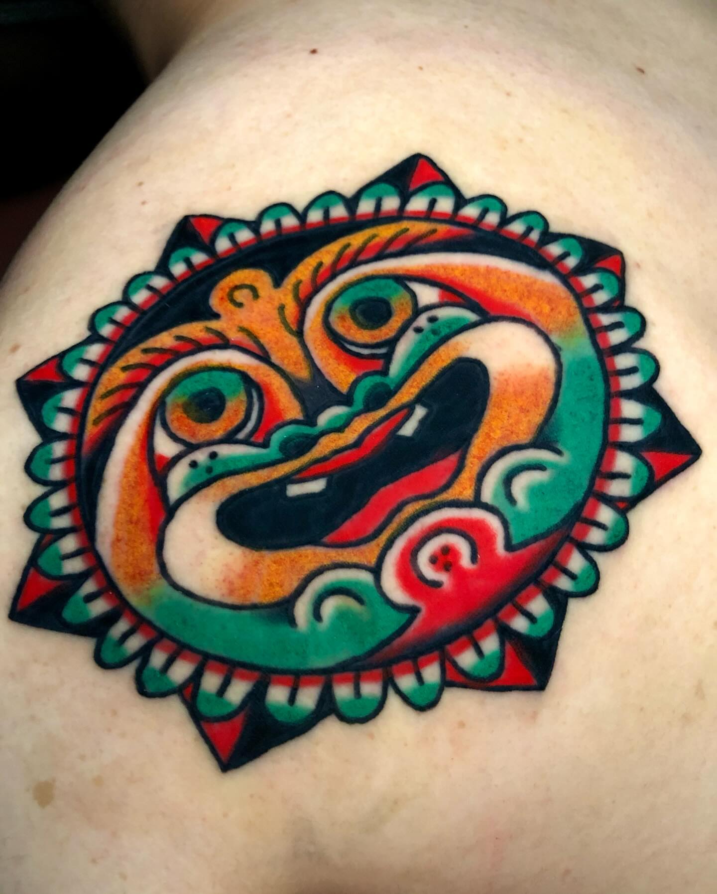 Lion American traditional tattoo on the shoulder by Javin Klingelhoefer Mosley