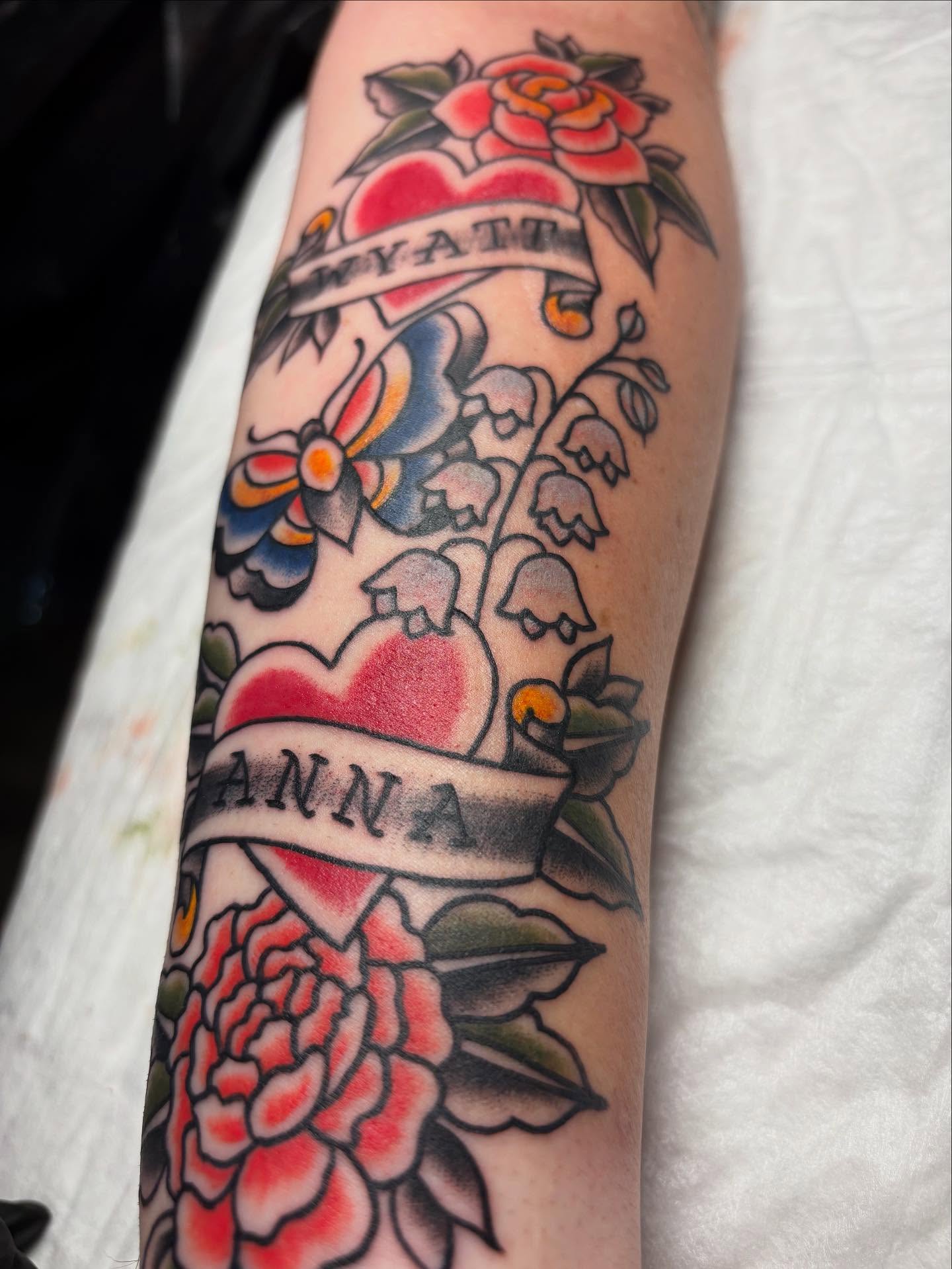 Heart and floral arrangement American traditional tattoo on the forearm by gia❤️‍🔥🎲, Maryville, Tennessee