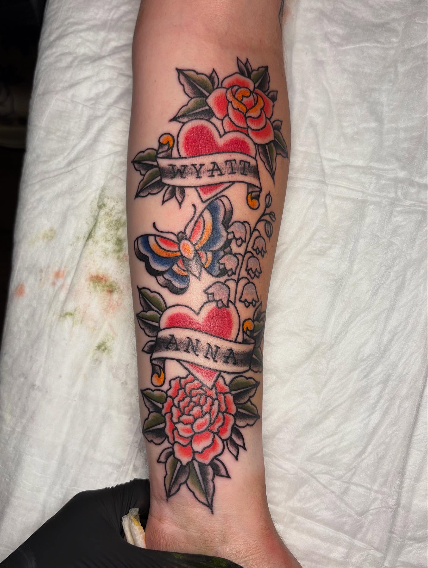 Hearts and flowers American traditional tattoo on the forearm by gia❤️‍🔥🎲, Maryville, Tennessee