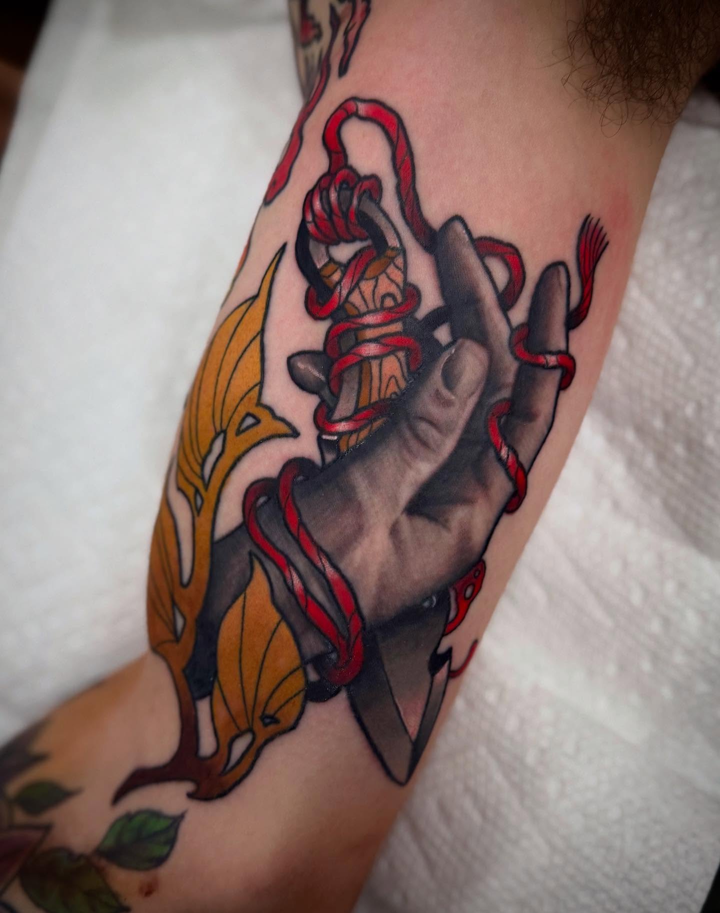 Hand with rope American traditional tattoo on the forearm by Sam Babcock