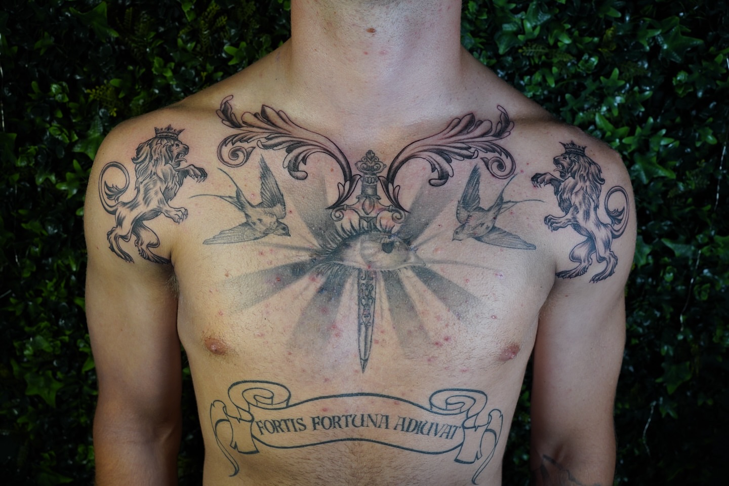 Eye with rays black and grey tattoo on the chest by Jaiden Ducoff