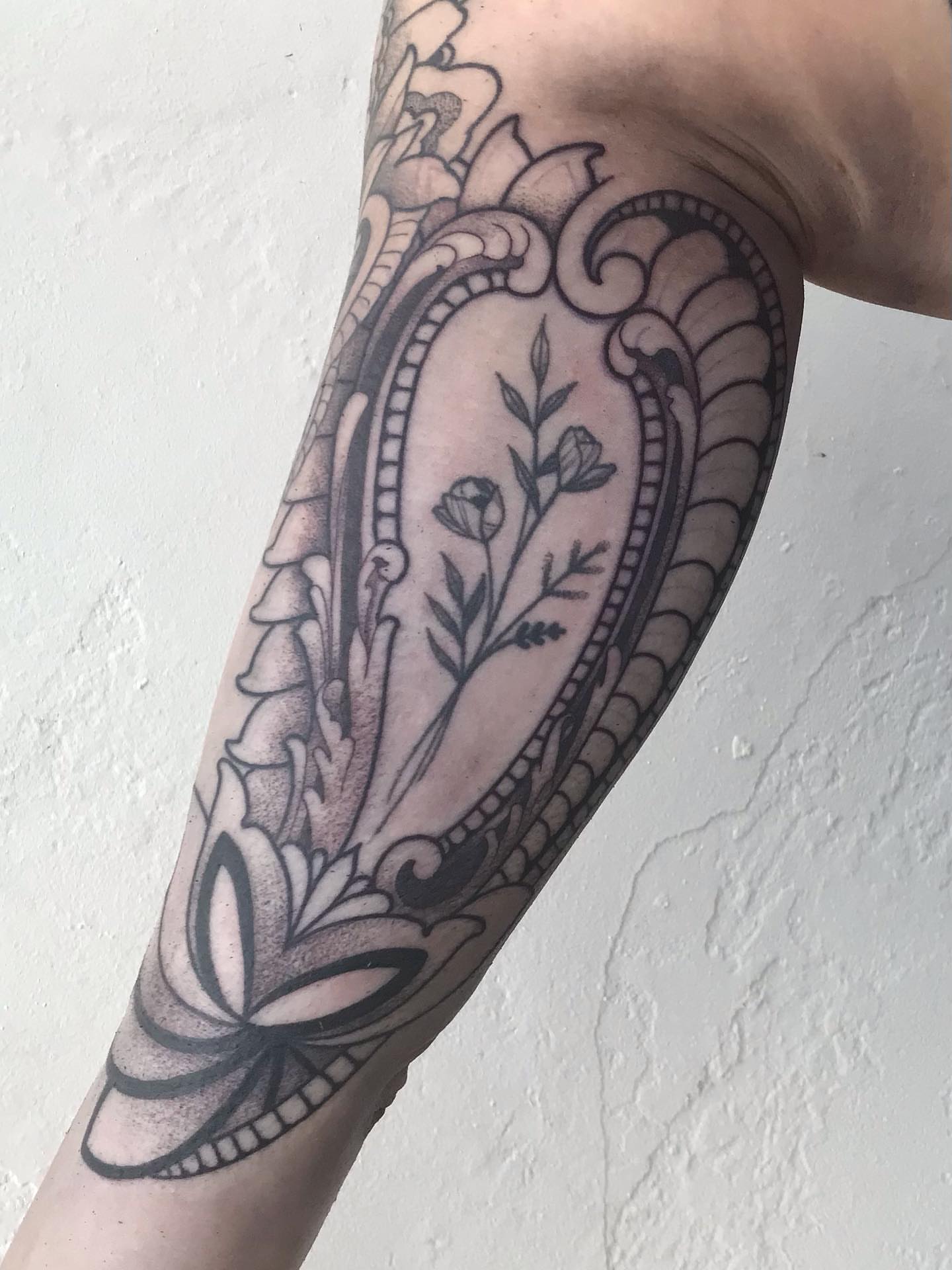 Floral ornament ornamental tattoo on the forearm by Sean Hollinger