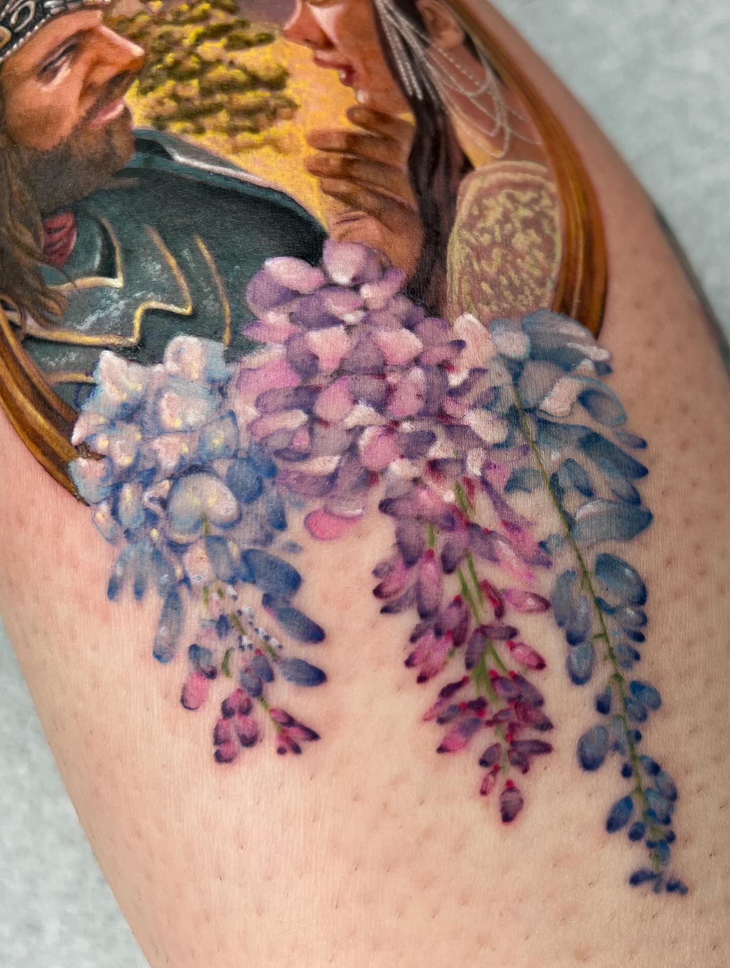 Wisteria watercolor tattoo on the thigh by Severin Black