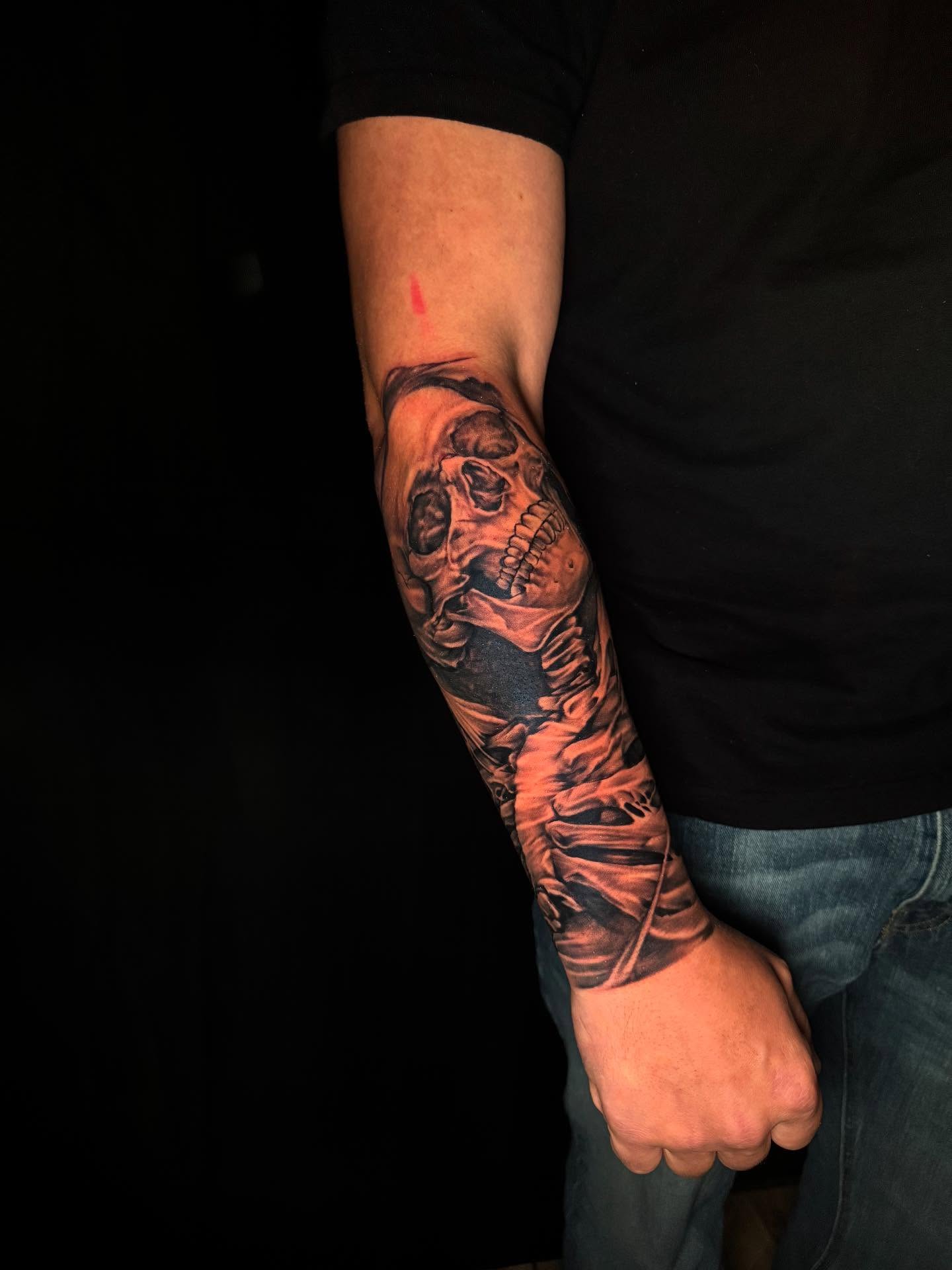 Skull realism tattoo on the forearm by Tattoos By Chico