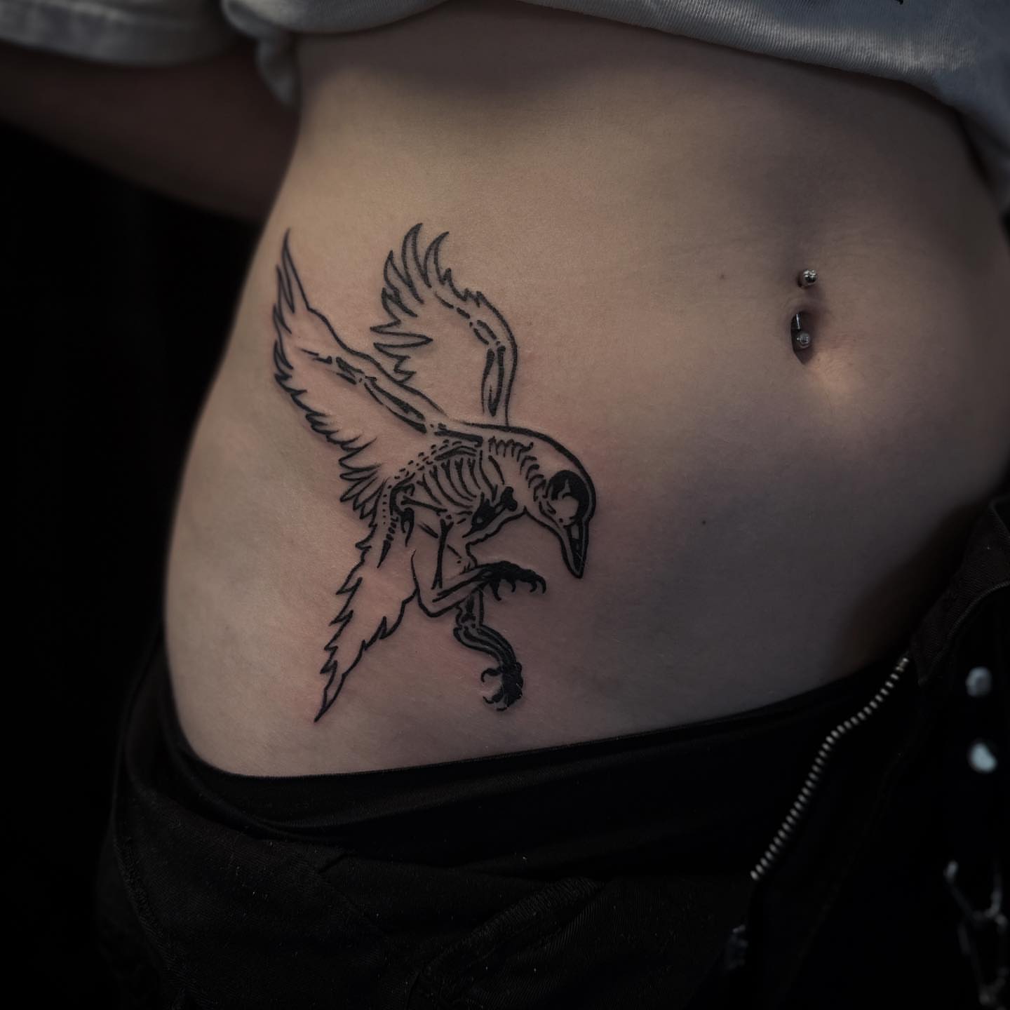 Crow black and grey tattoo on the ribs by 𝕽𝖎𝖌𝖊𝖗𝖘 𝕳𝖆𝖒𝖟𝖆, San Francisco, California