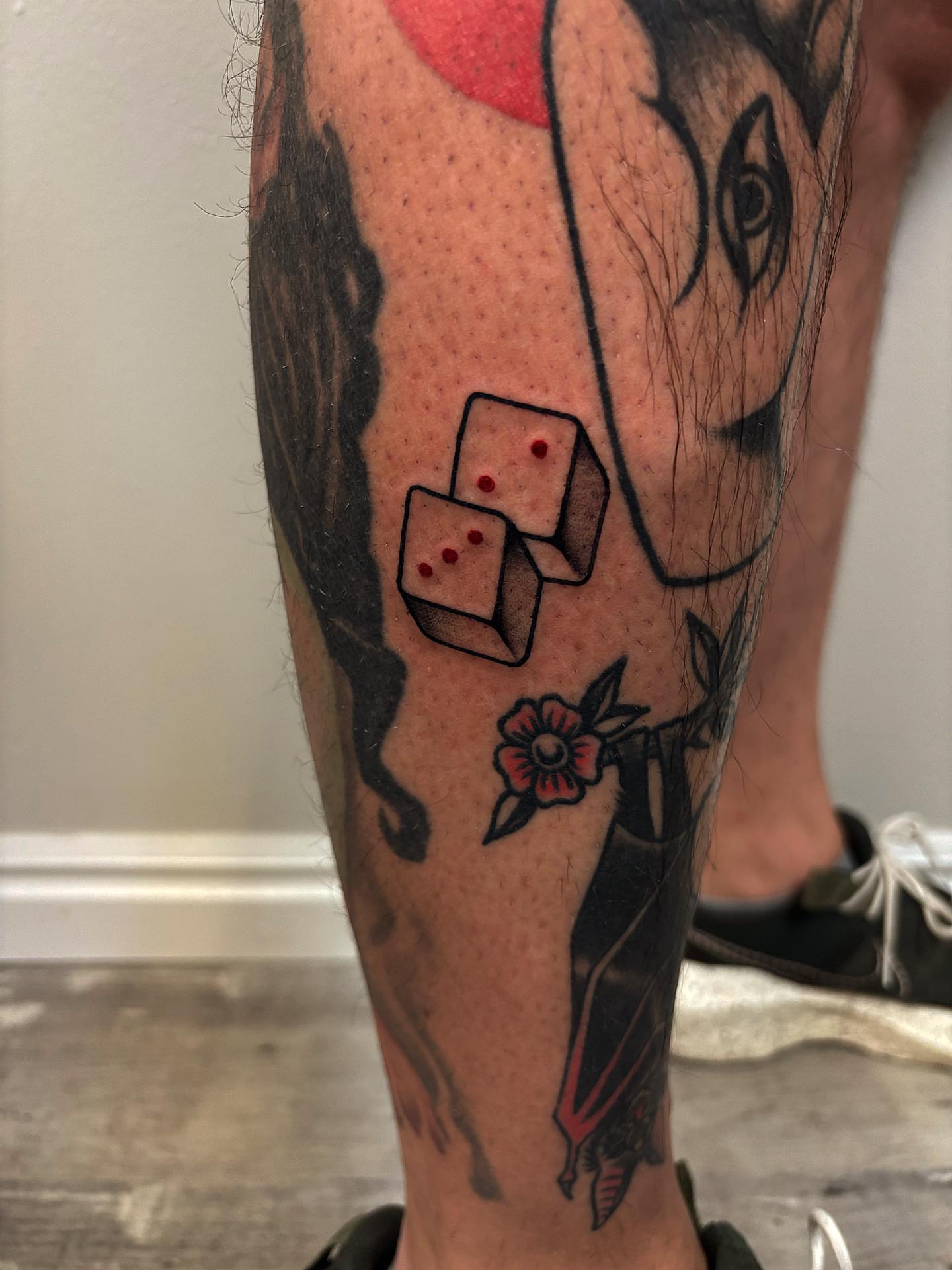 Dice American traditional tattoo on the calf by Brii Moser