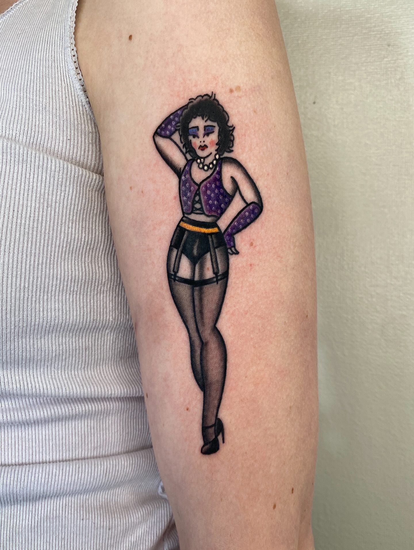 Pin-up girl illustrative tattoo on the forearm by Aidan Leery, Portland, Oregon