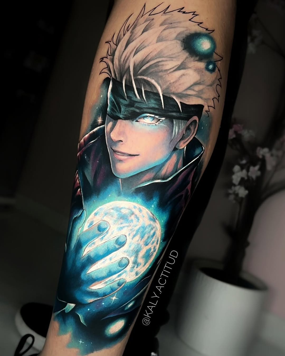 Gojo Satoru holding a glowing orb anime tattoo on the forearm by Kaly, Manhattan, NYC