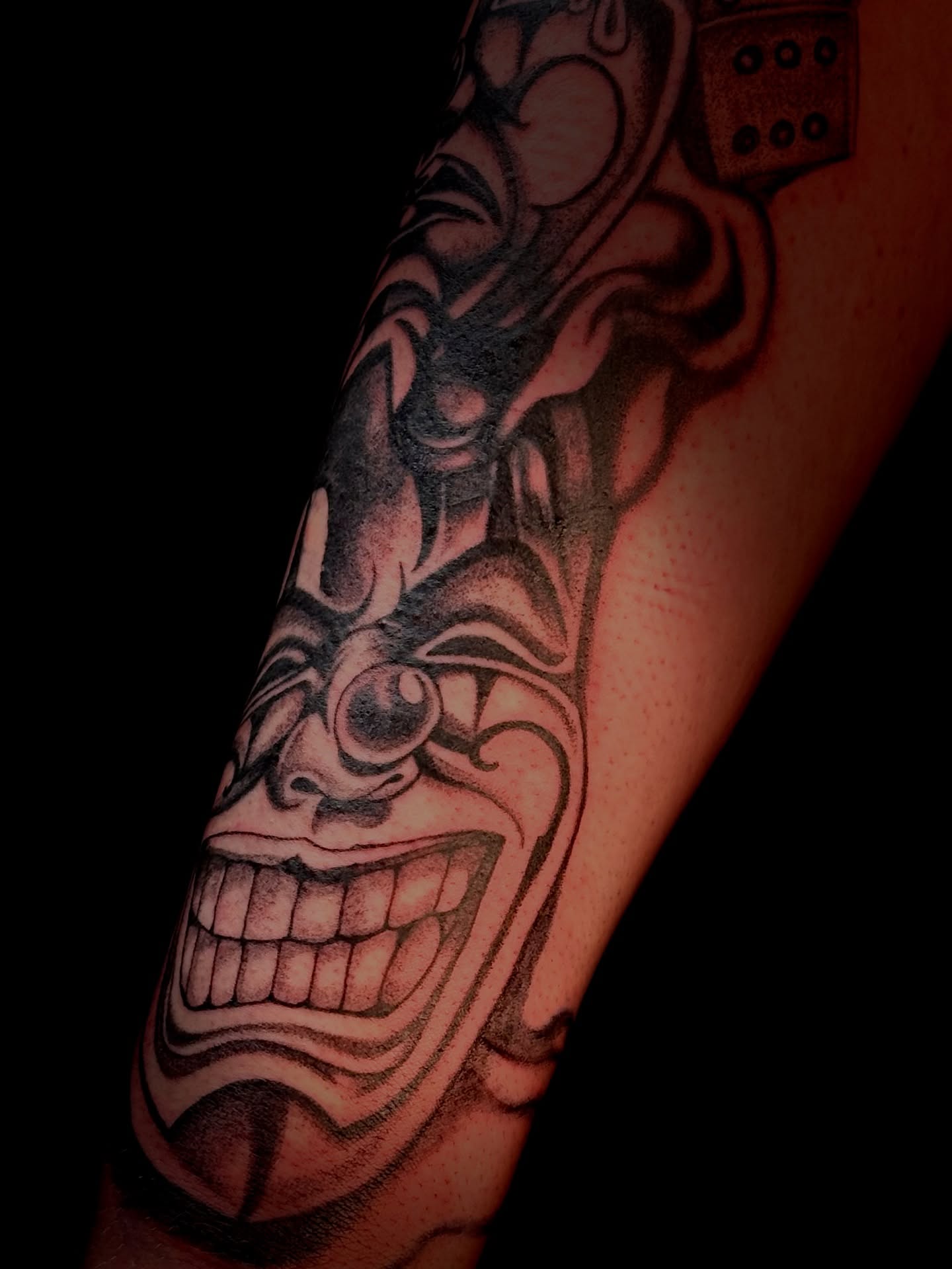 Japanese mask geometric tattoo on the forearm by Виктория Лукьянова