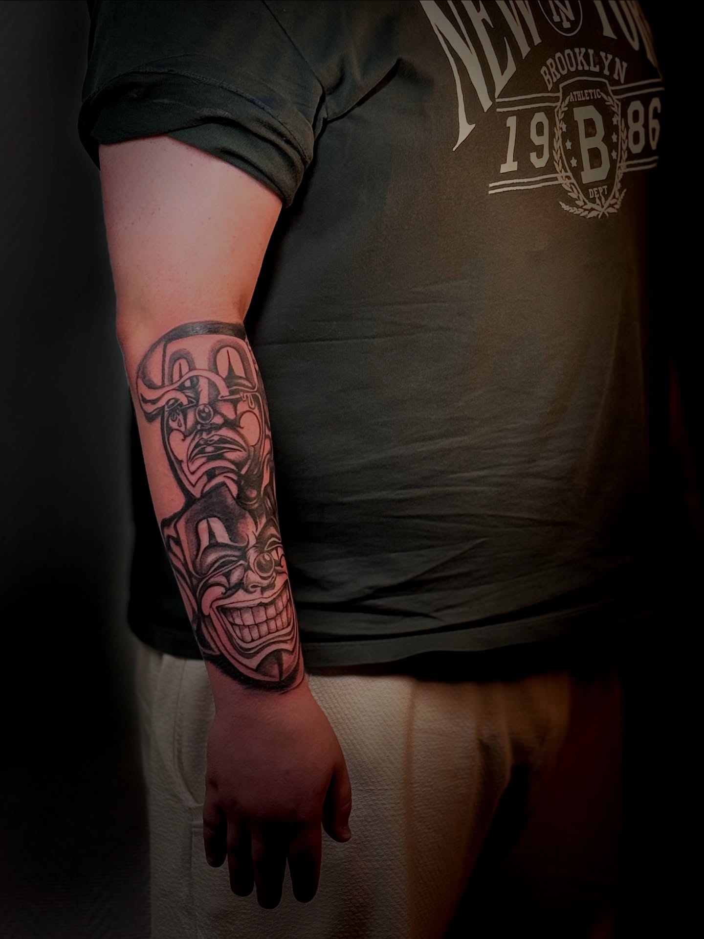 Mask and skull American traditional tattoo on the forearm by Виктория Лукьянова