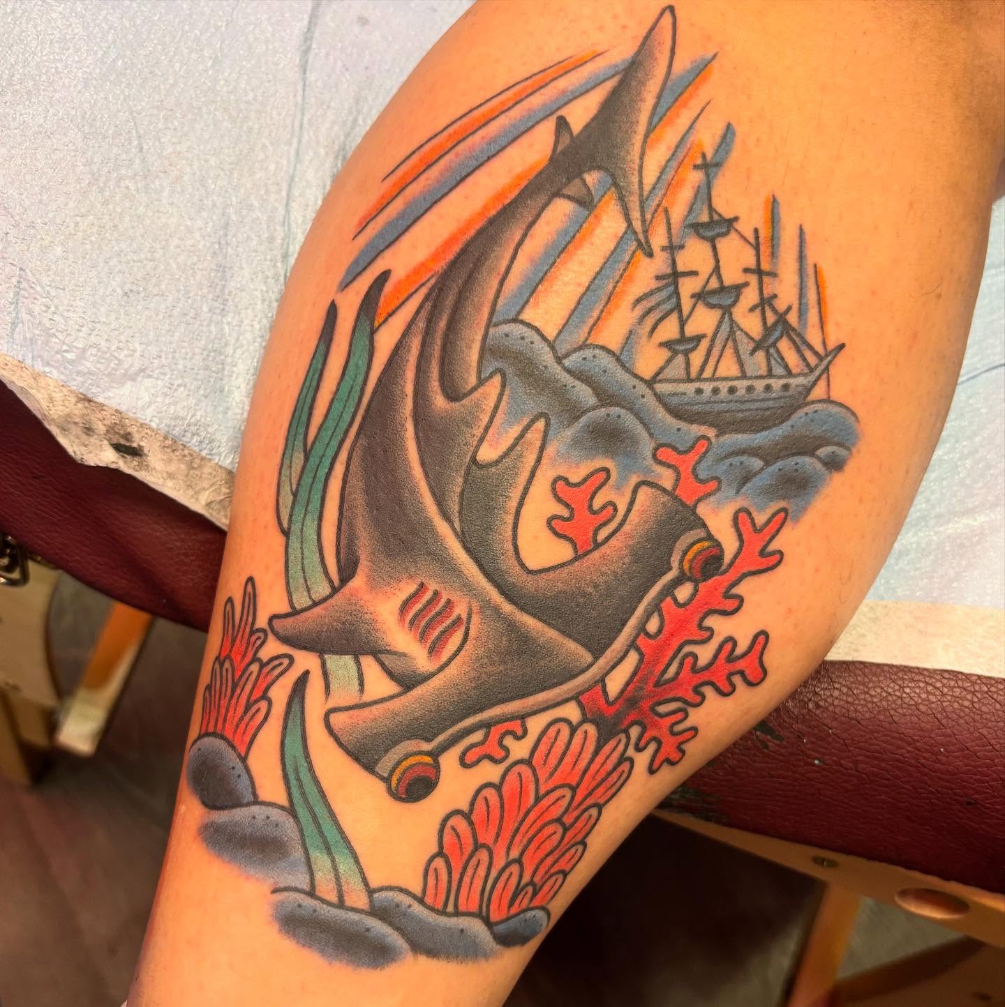 Ship and shark American traditional tattoo on the forearm by @dannydoestattoos