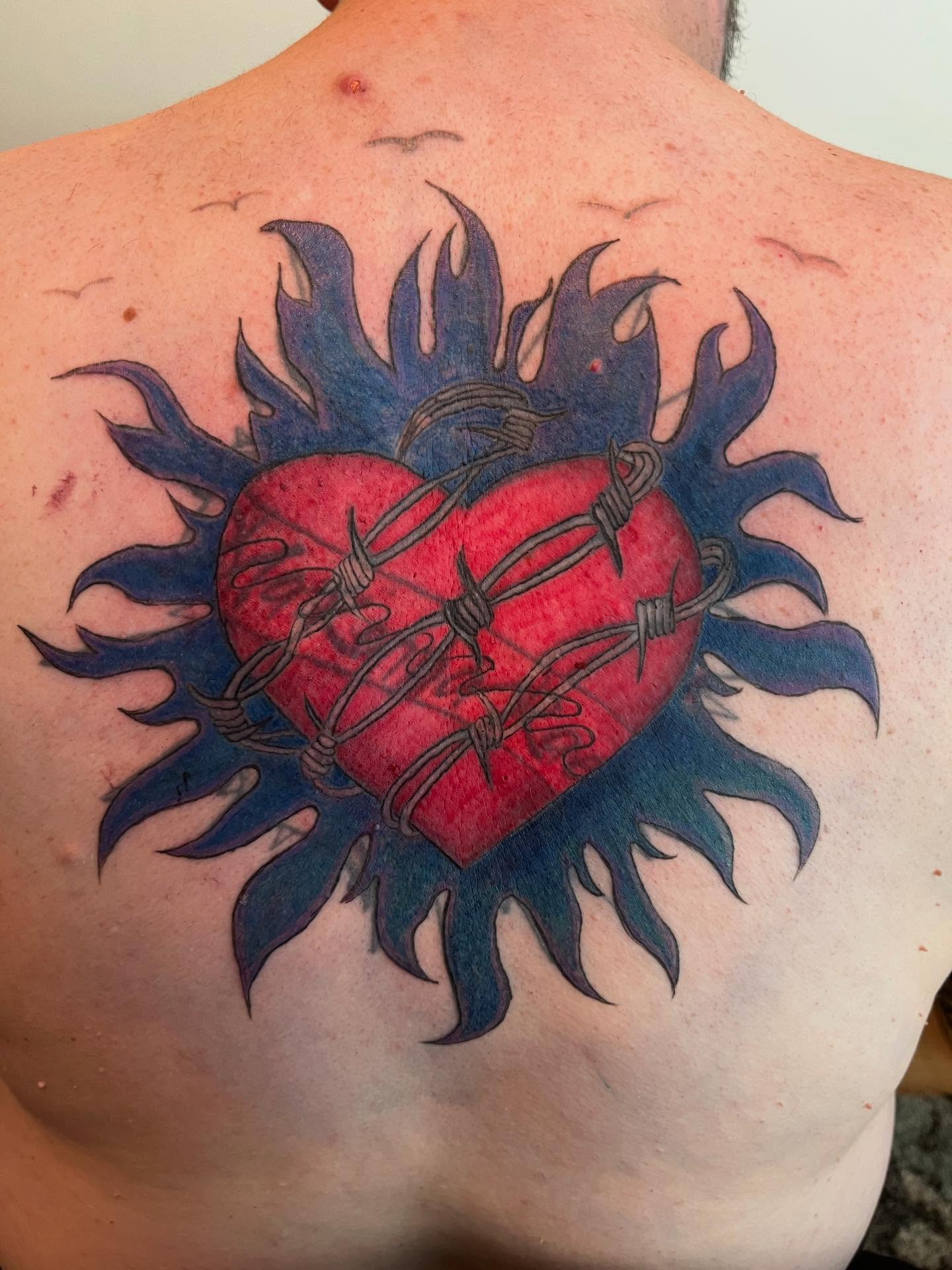 Barbed heart neo-traditional tattoo on the back by Val Maughan