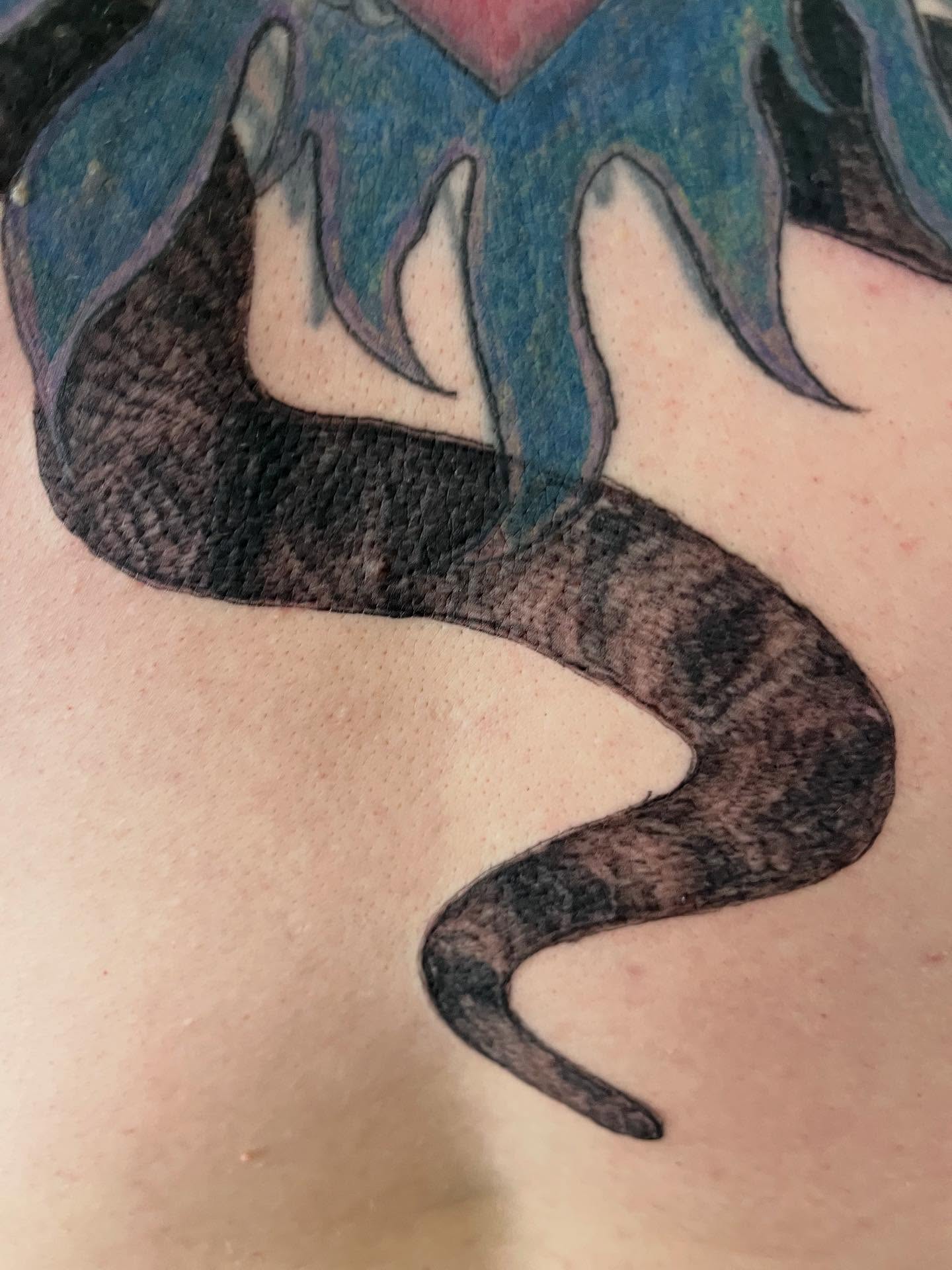 Snake American traditional tattoo on the shoulder by Val Maughan