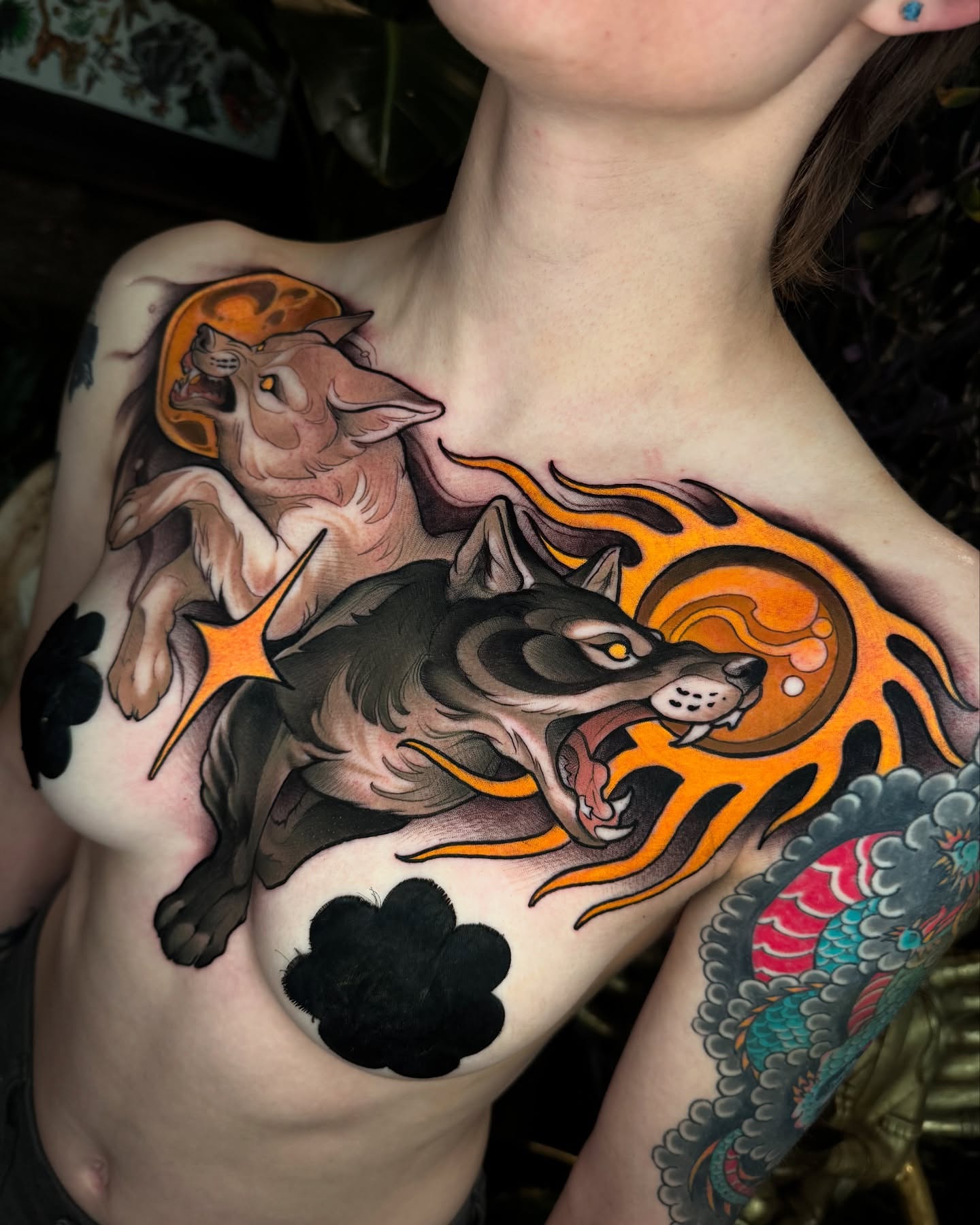 Wolf and flames American traditional tattoo on the chest by Freddie Brown, Lombard, IL