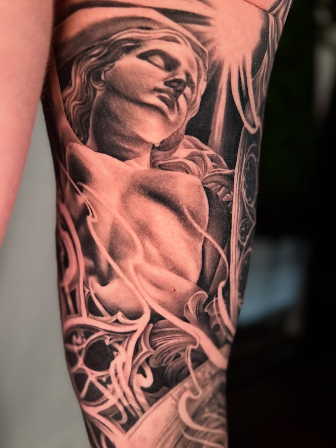 Sculptural bust with ornate details realism tattoo on the forearm by April Lynn