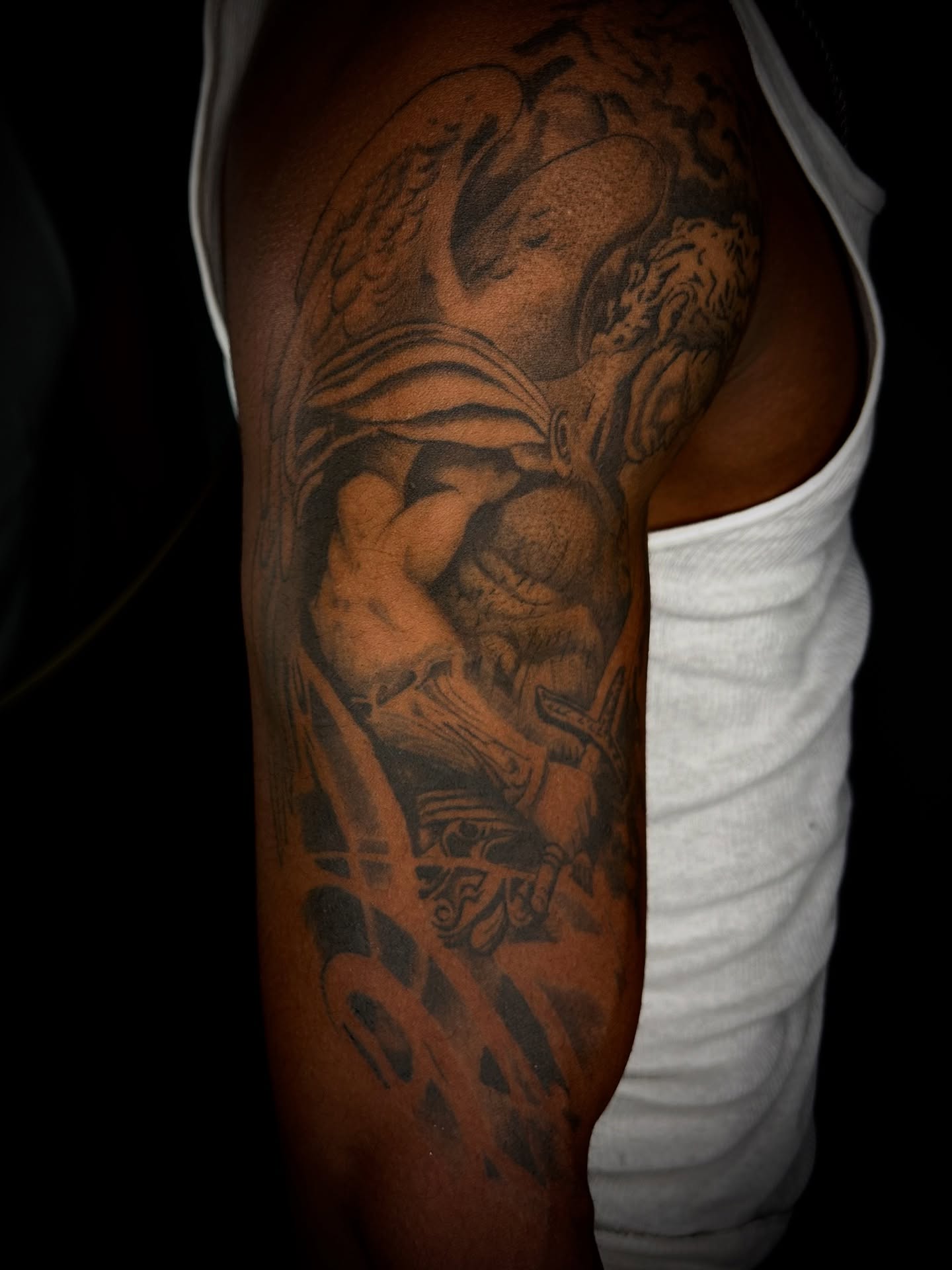 Mythical creature black and grey tattoo on the upper arm by Cleveland Tattoo Artist, Cleveland, Ohio