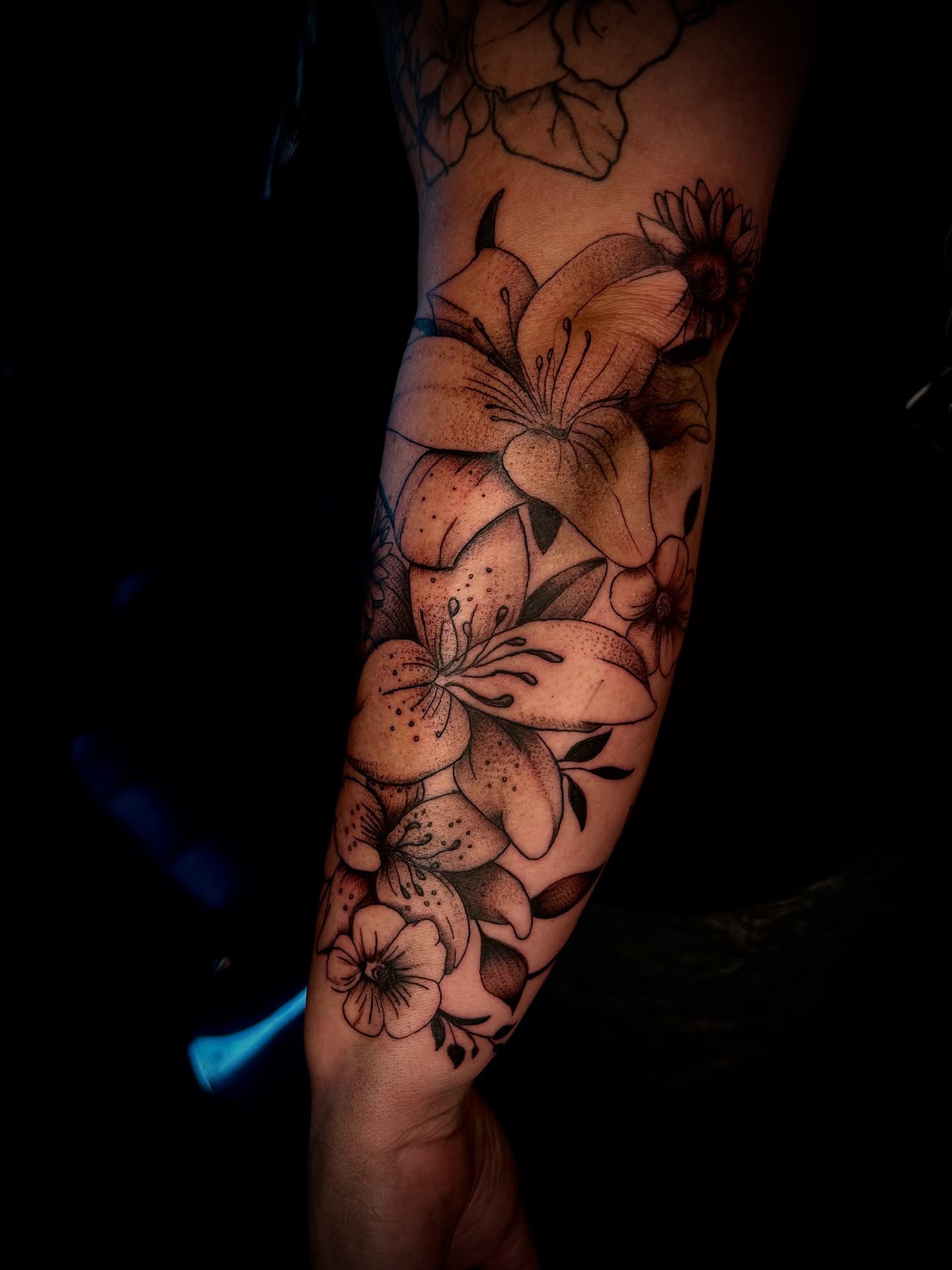 Lilies and flowers dotwork tattoo on the forearm by Cleveland Tattoo Artist, Cleveland, Ohio