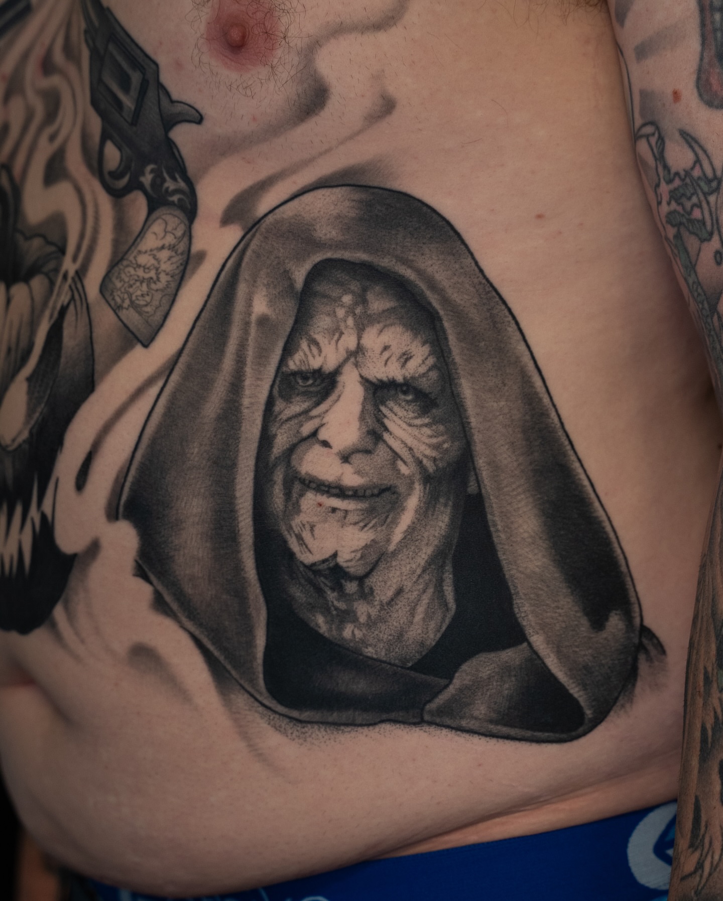 Emperor palpatine realism tattoo on the chest by Chris Estrada