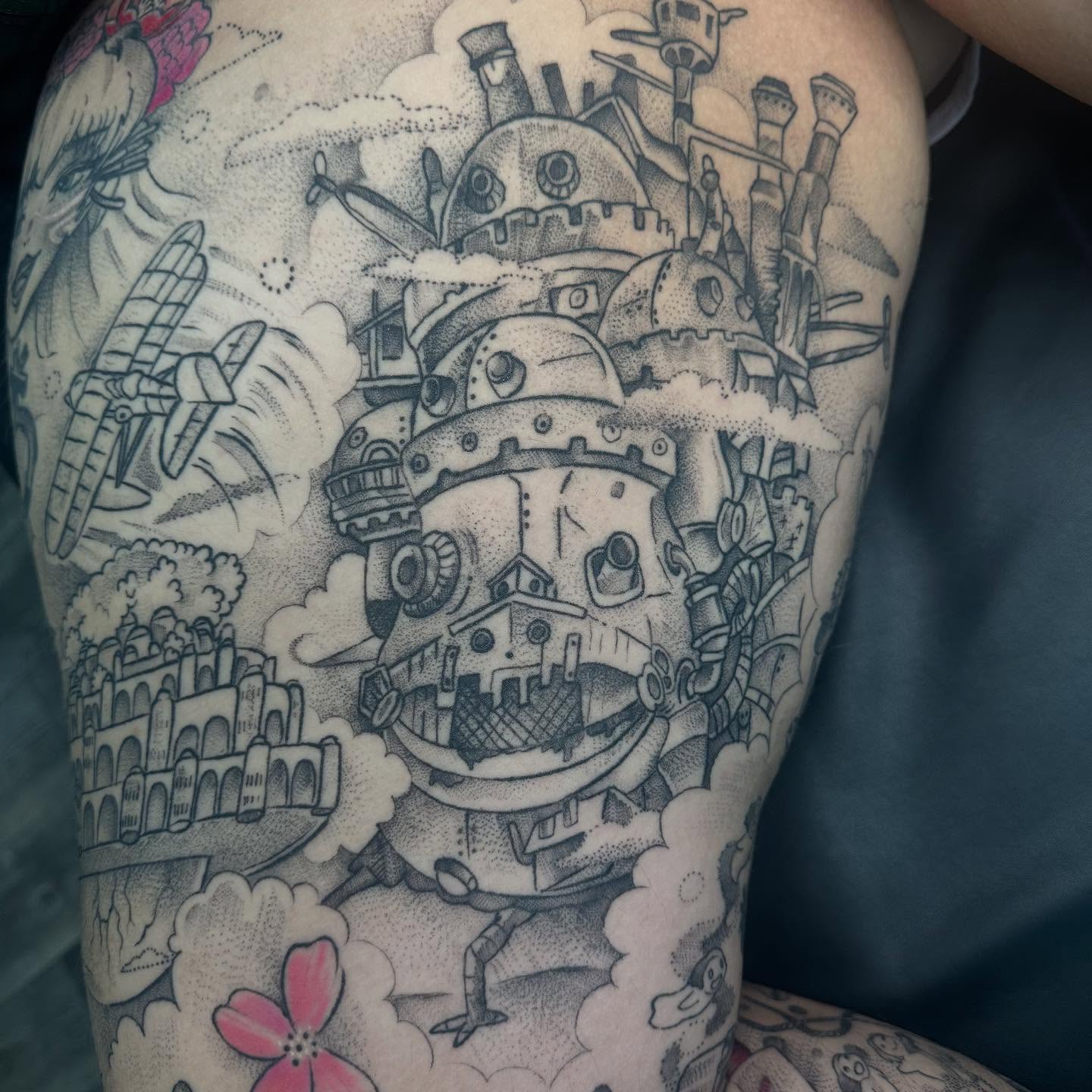 Mechanical castle dotwork tattoo on the thigh by Halle Haas