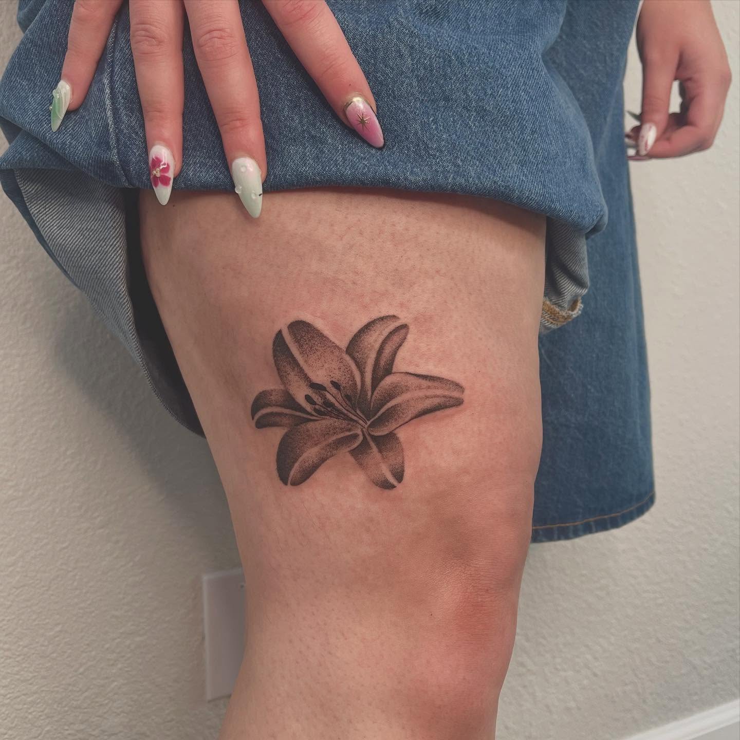 Lily dotwork tattoo on the thigh by Las Vegas Tattoo Artist