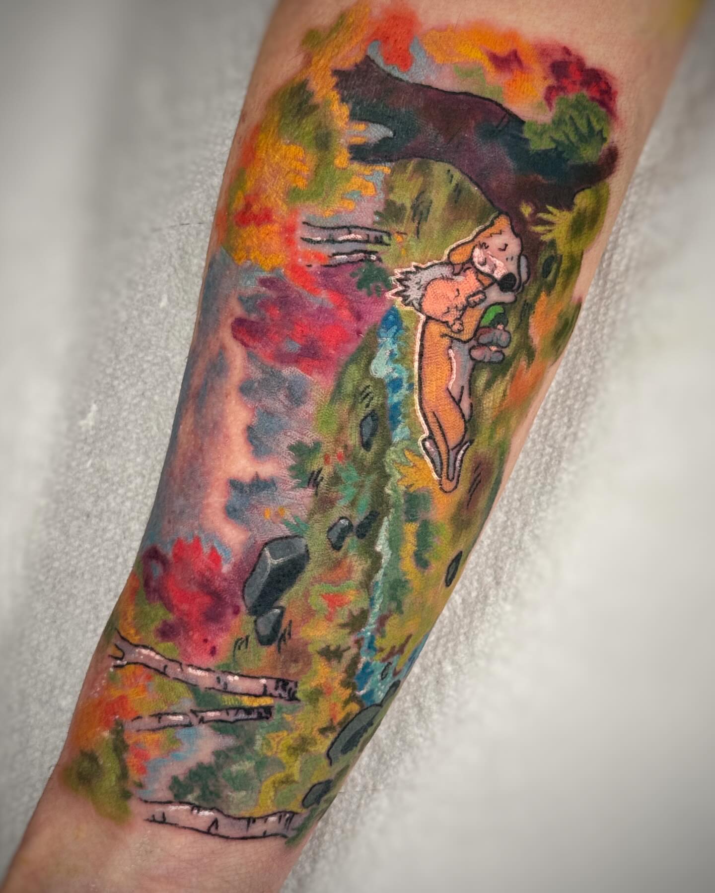 Autumn landscape with dog watercolor tattoo on the forearm by Anna Saveria