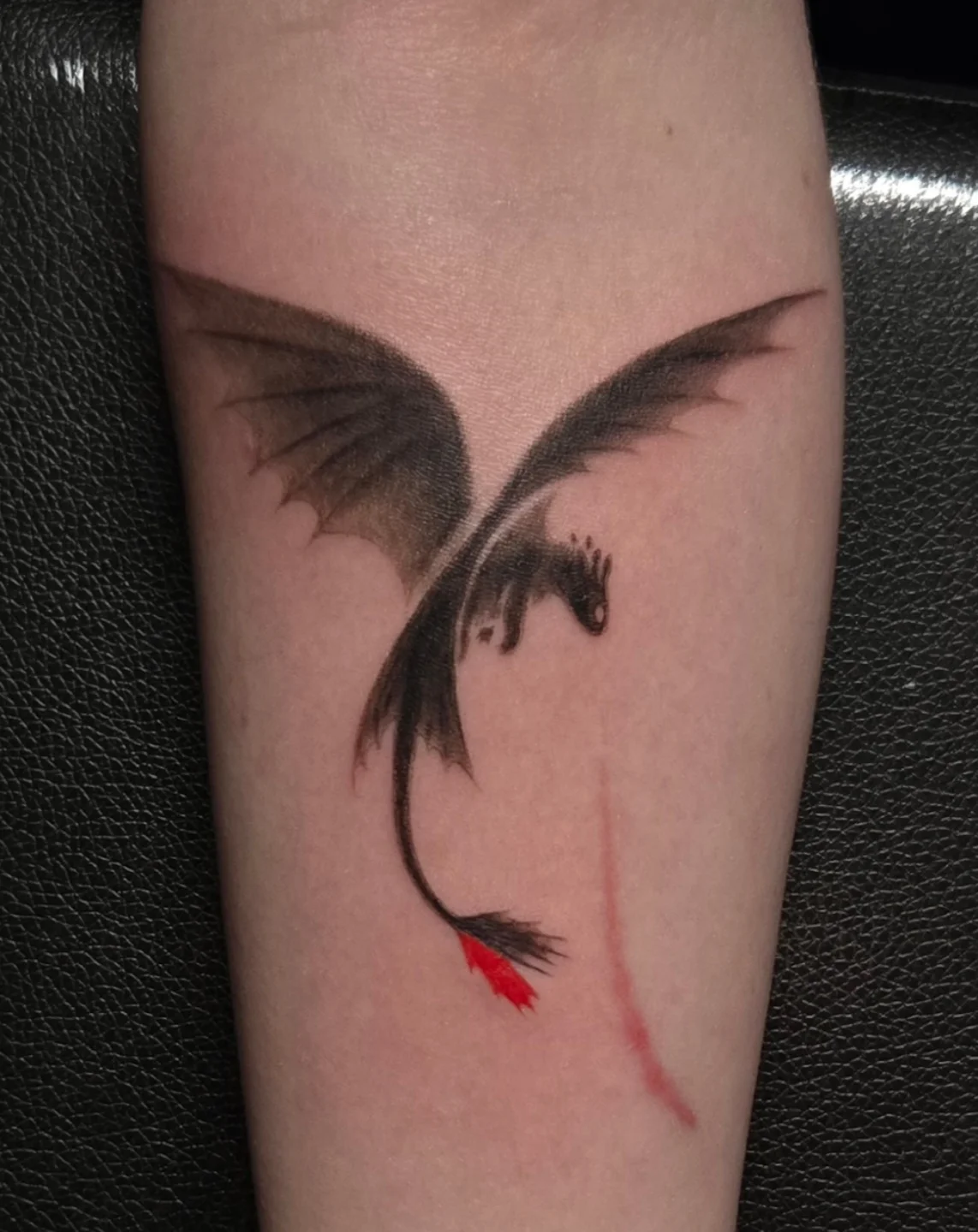 Dragon dark realism tattoo on the forearm by Bek Artz