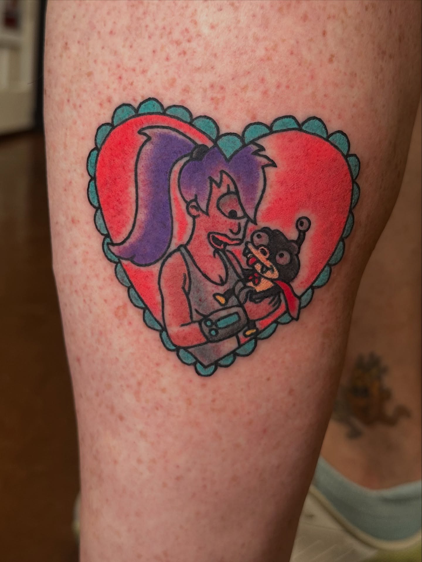 Heart with characters American traditional tattoo on the thigh by Nick Bones, Las Vegas, Nevada
