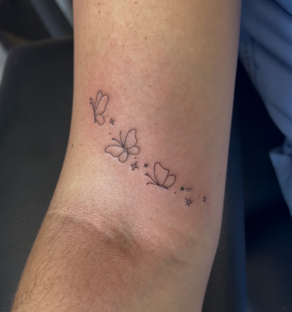Butterflies fine line tattoo on the forearm by Cortnie, Nashville, Tennessee