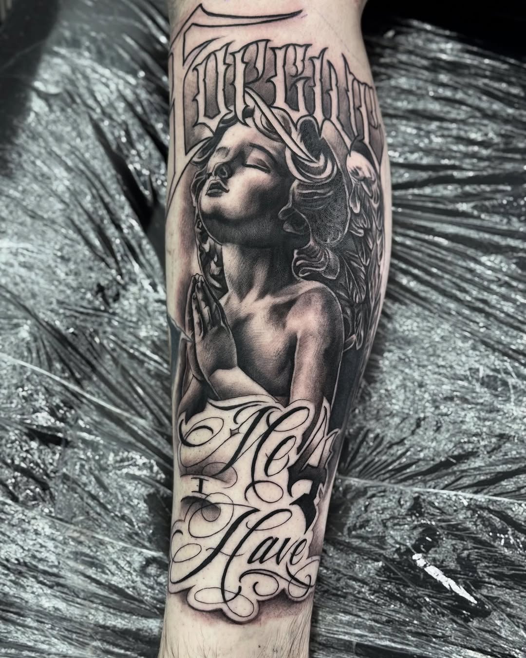 Tattoo by @mannyfacestattoo — realism, lettering_script