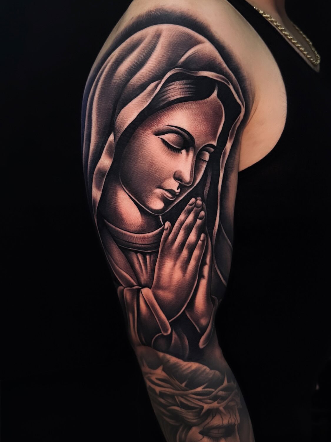 Praying woman realism tattoo on the upper arm by ⚜️Alex Alvarez⚜️