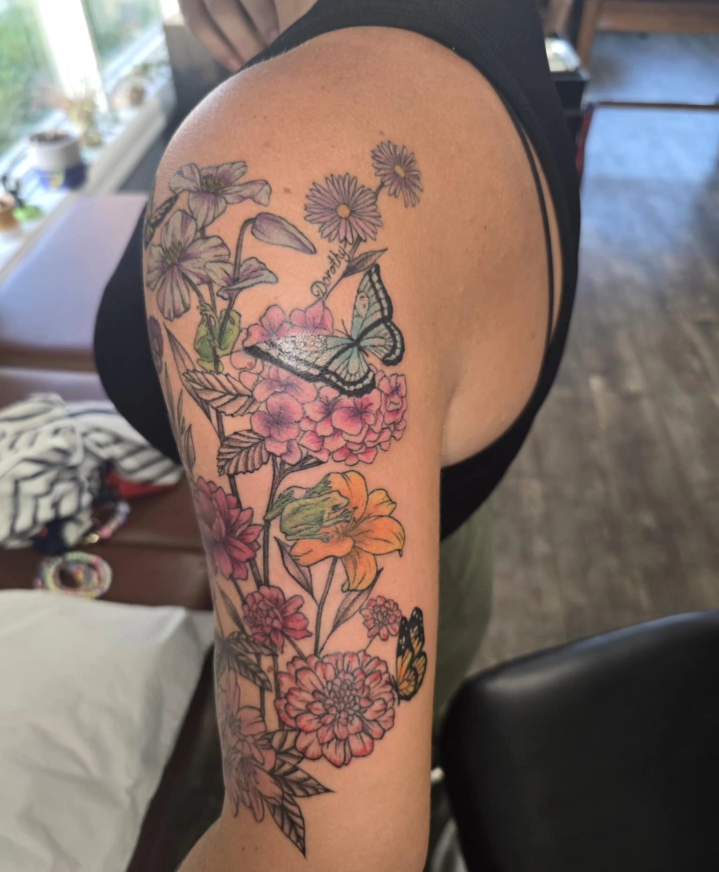 Flowers and butterflies new school tattoo on the forearm by Hope Powell, Vancouver, Washington