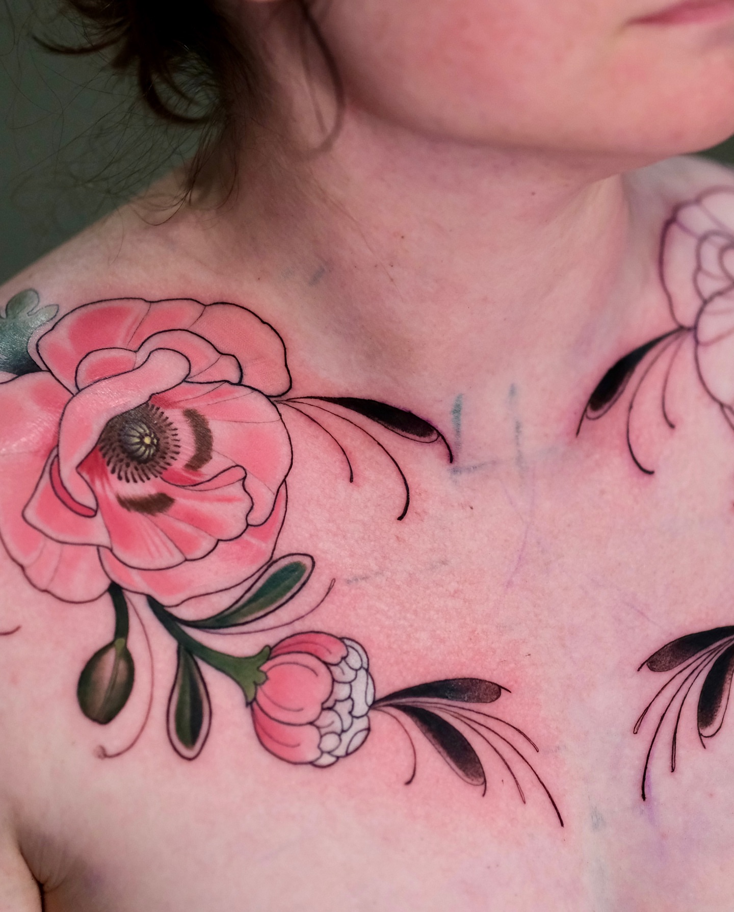 Flower American traditional tattoo on the chest by Andres Acevedo, Denver, Colorado