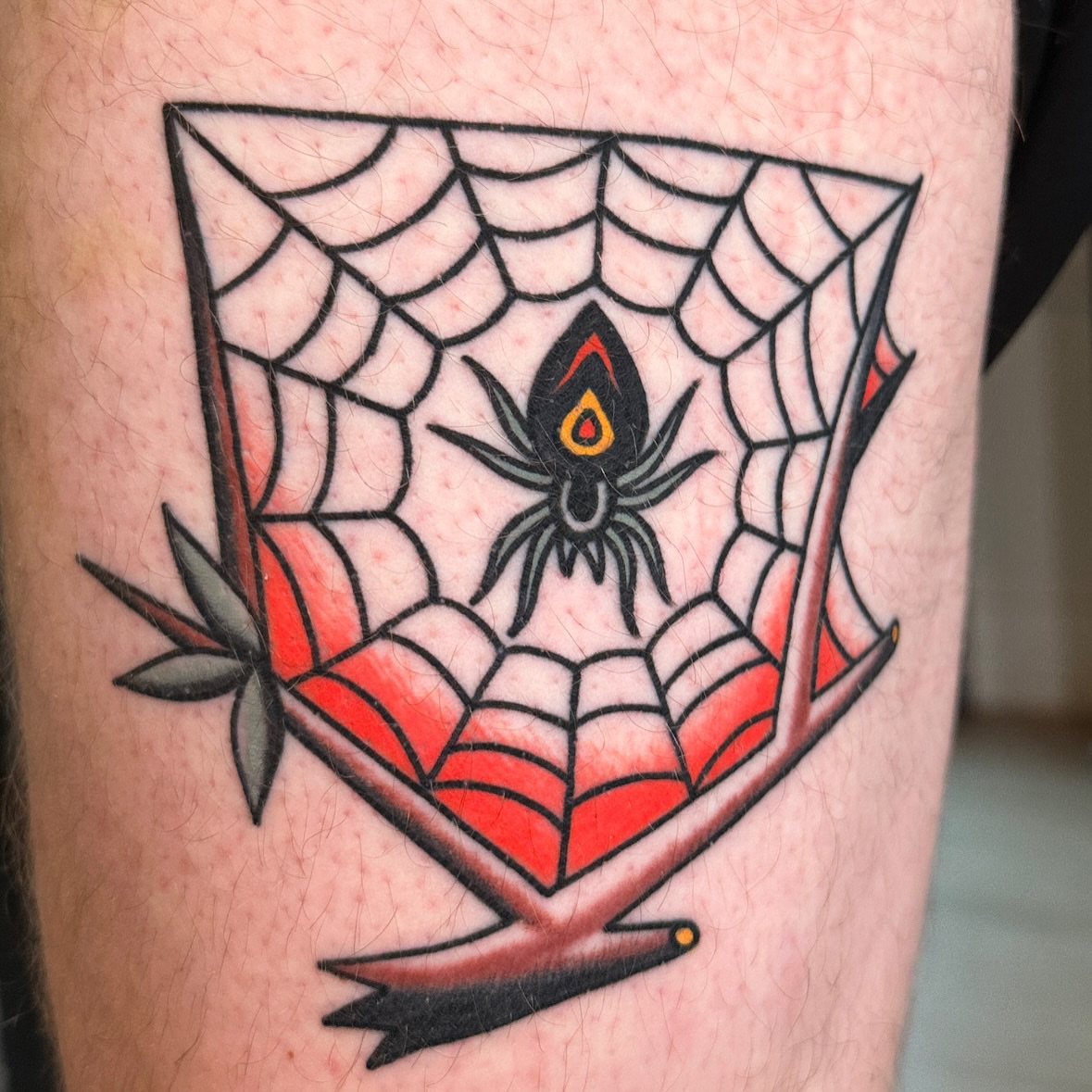 Spider web American traditional tattoo on the forearm by Chaz Otto