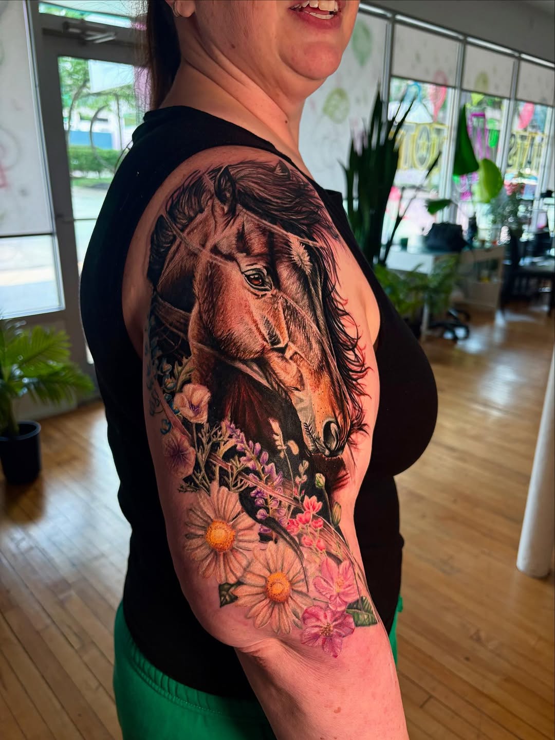 Horse head with flowers neo-traditional tattoo on the upper arm by Jacee Hamilton