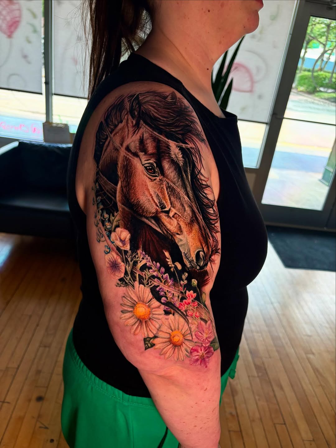 Horse head with flowers neo-traditional tattoo on the upper arm by Jacee Hamilton