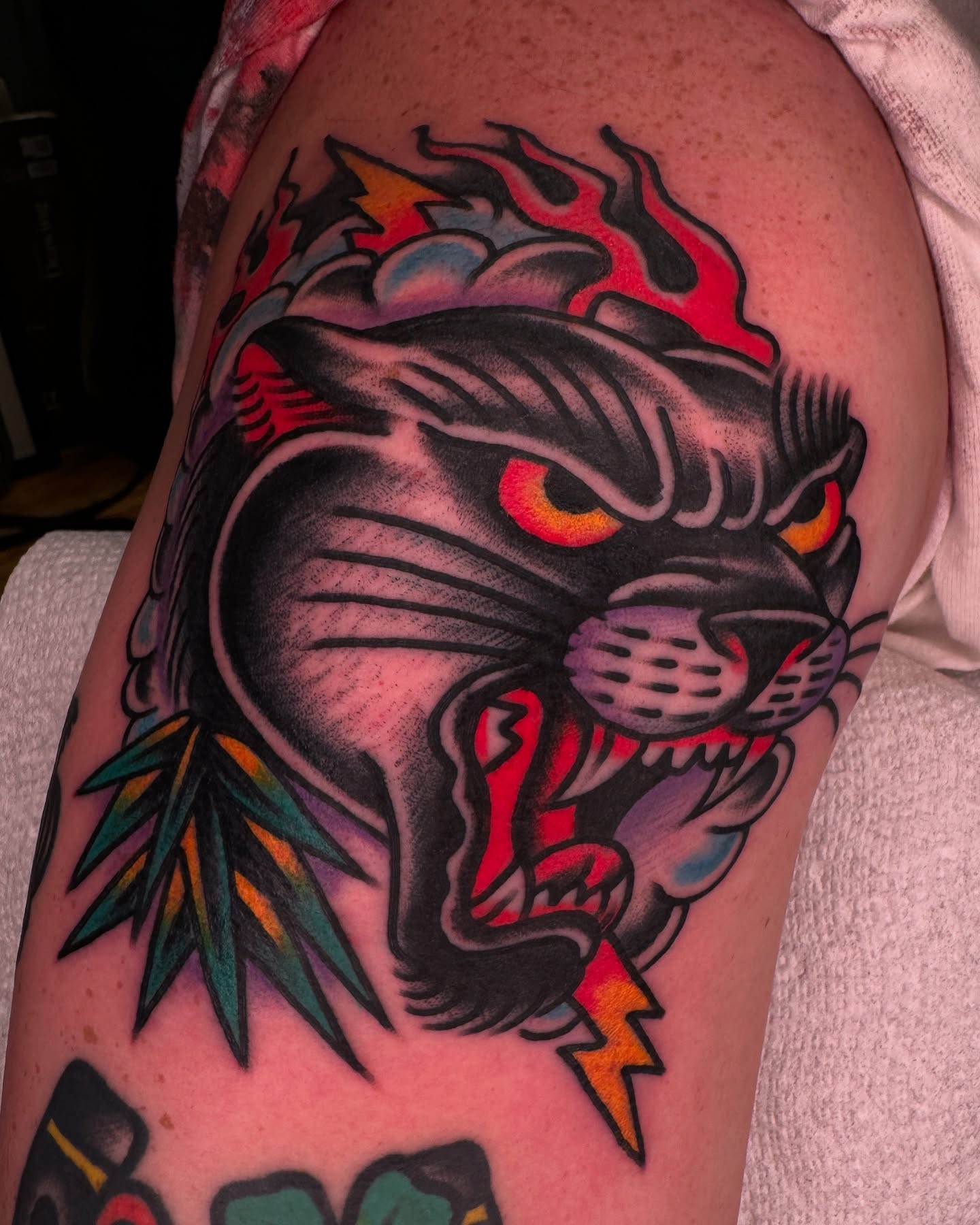 Panther American traditional tattoo on the shoulder by Tony Kaplan