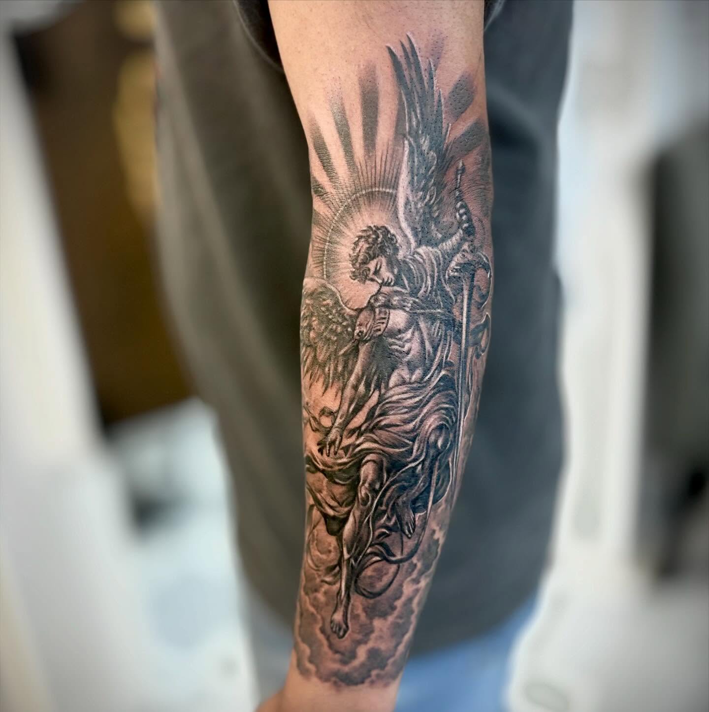 Angel with sword black and grey tattoo on the forearm by ๐๐๐๐๐๐๐ ๐ฌ.๐ผ
