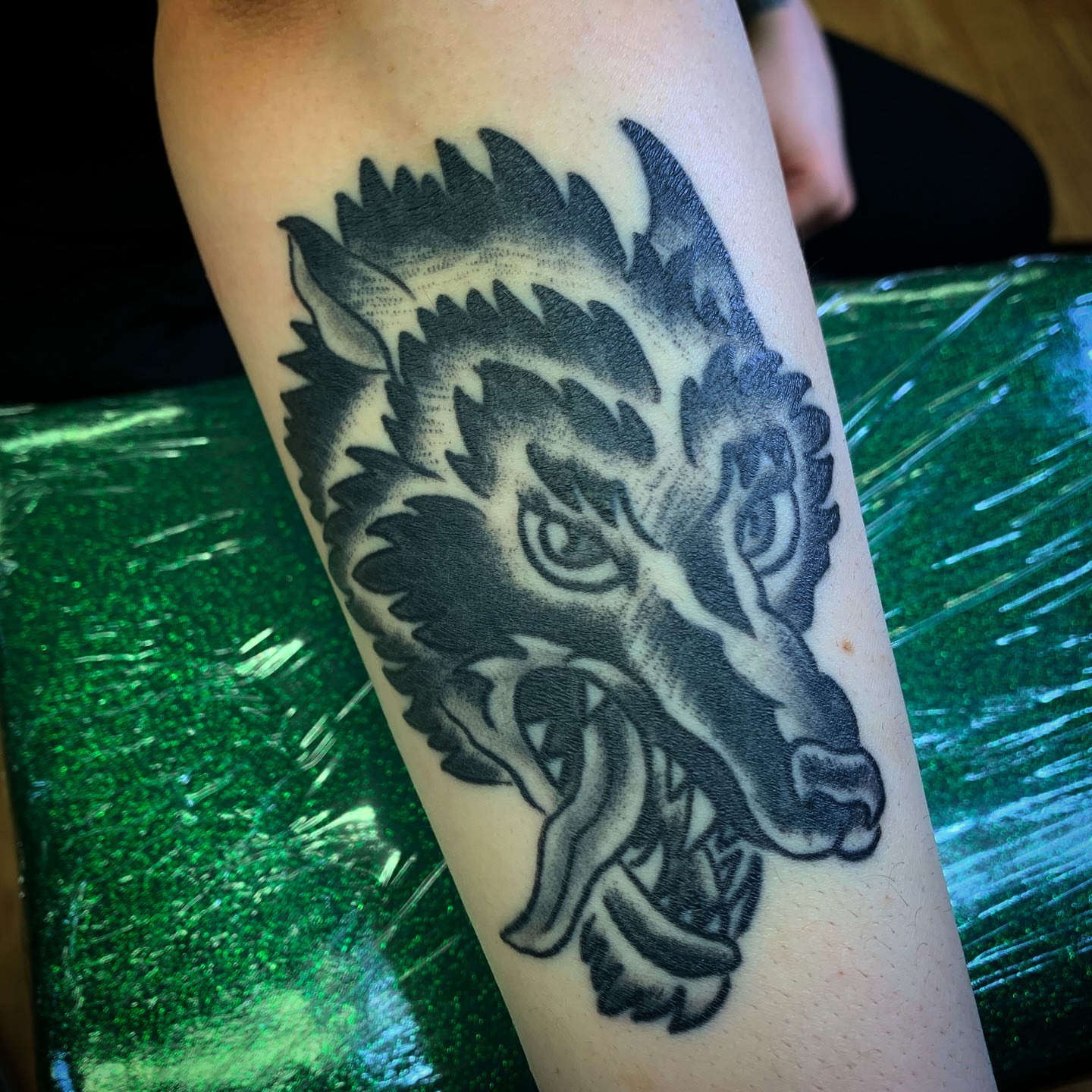 Wolf black and grey tattoo on the forearm by Tattoos Las Vegas,NV