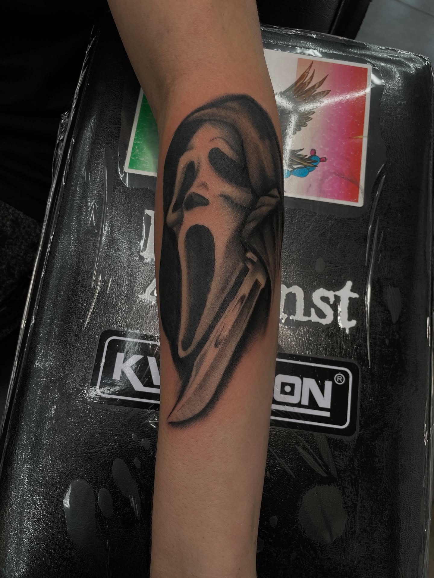 Scream mask realism tattoo on the forearm by Cultura