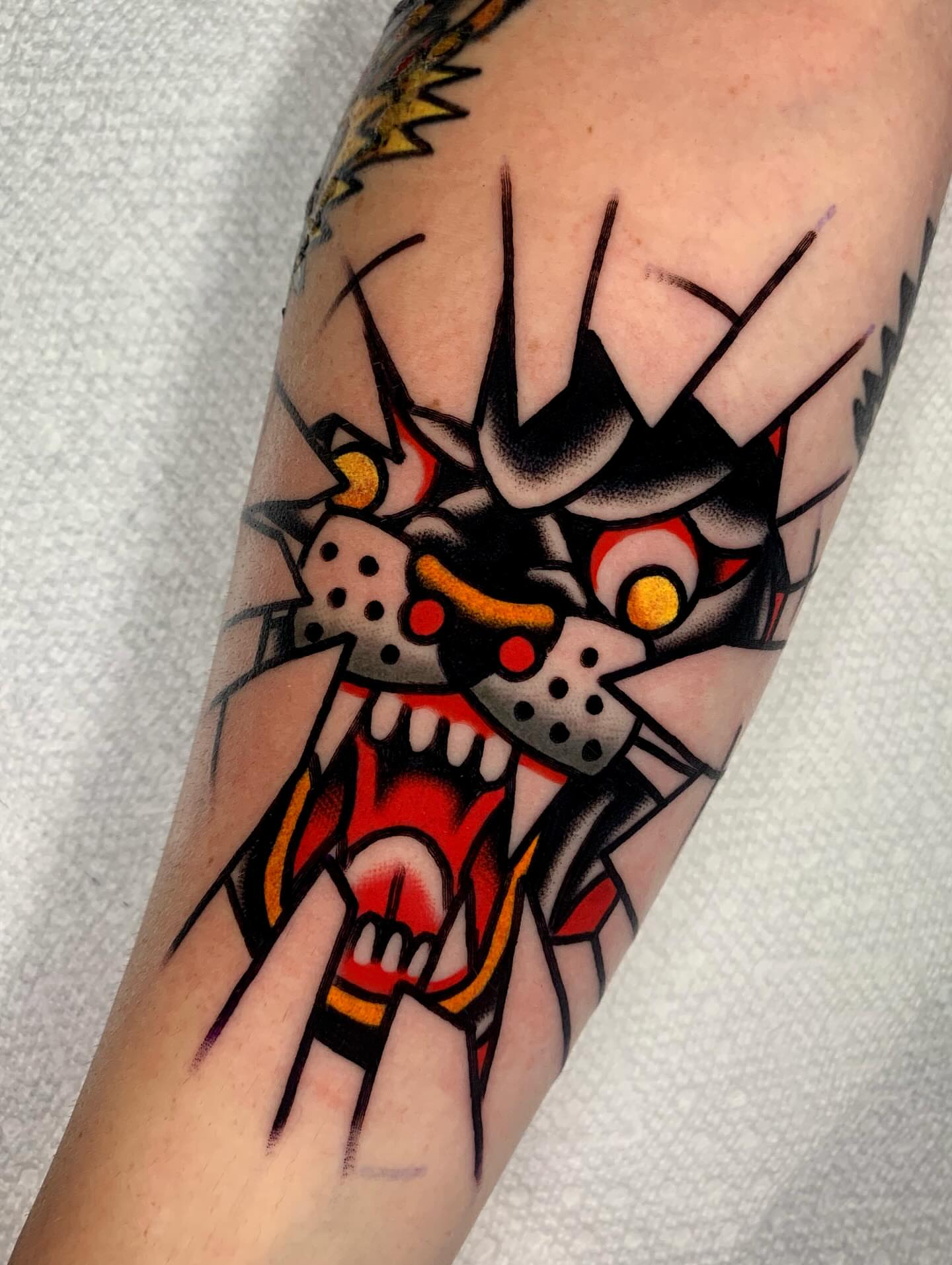 Cat American traditional tattoo on the forearm by Shawn VanKirk